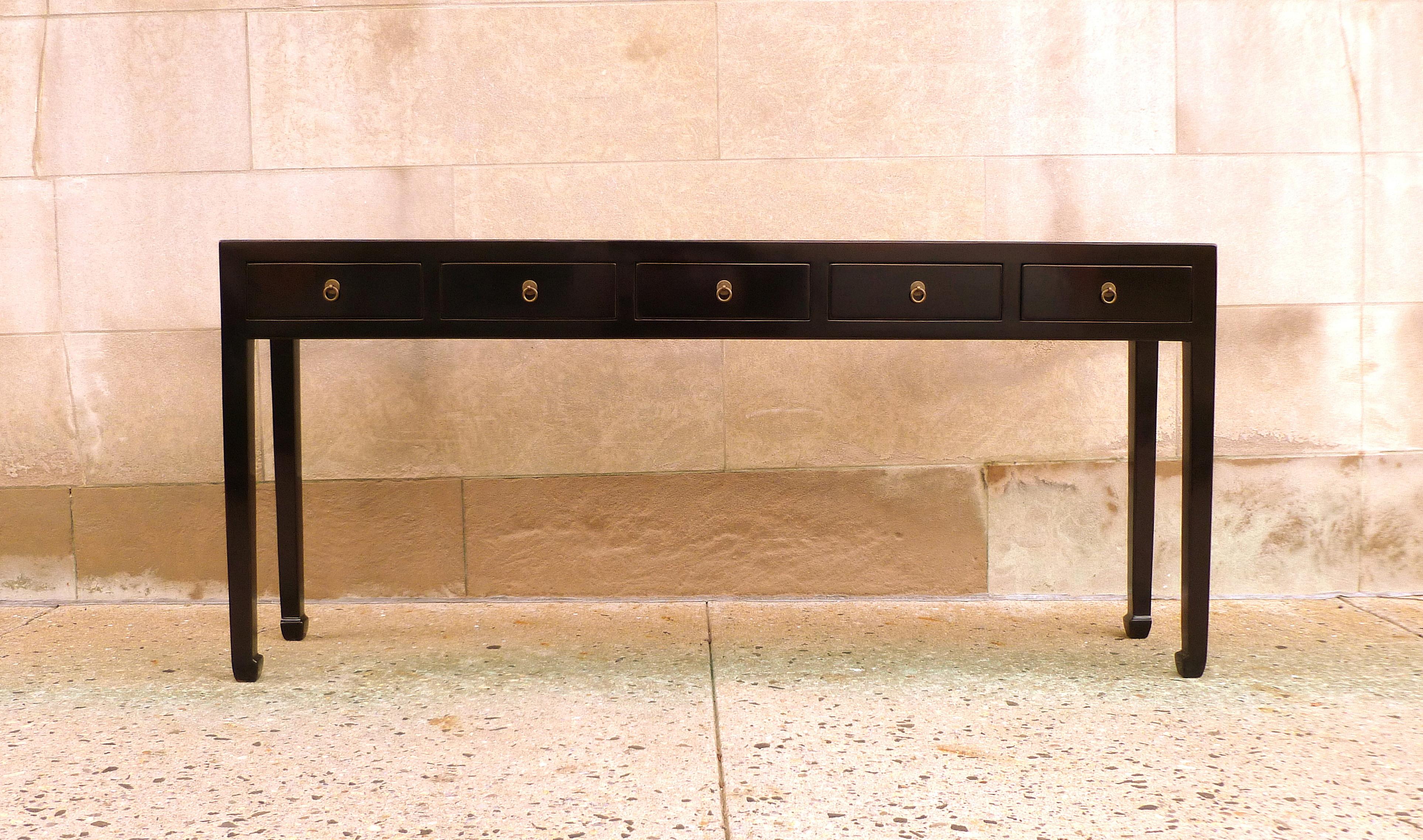 Elegant black lacquer console table with five drawers, brass fitting. Simple form and beautiful color. We carry fine quality furniture with elegant finished and has been appeared many times in 