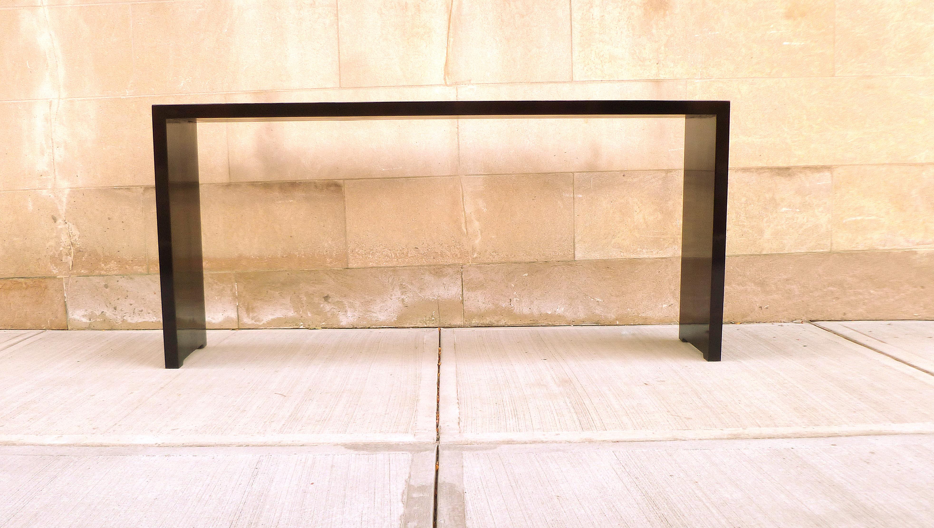 Simple black lacquer console table with waterfall legs, elegant color and lines. We carry fine quality furniture with elegant finished and has been appeared many times in 