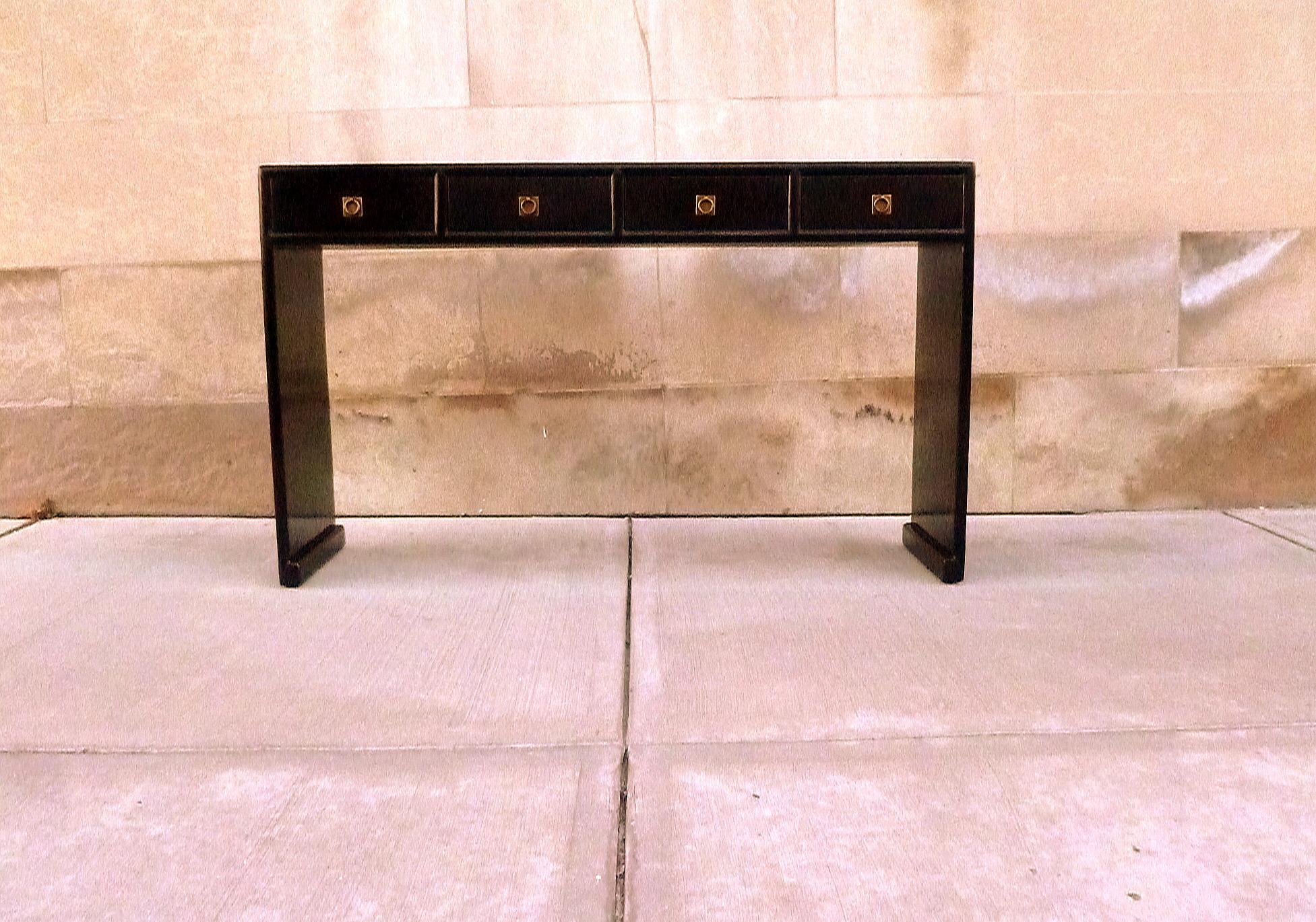 Fine black lacquer console table with four drawers, waterfall legs, brass fitting, elegant and simple form, beautiful lines. We carry fine quality furniture with elegant finished and has been appeared many times in 