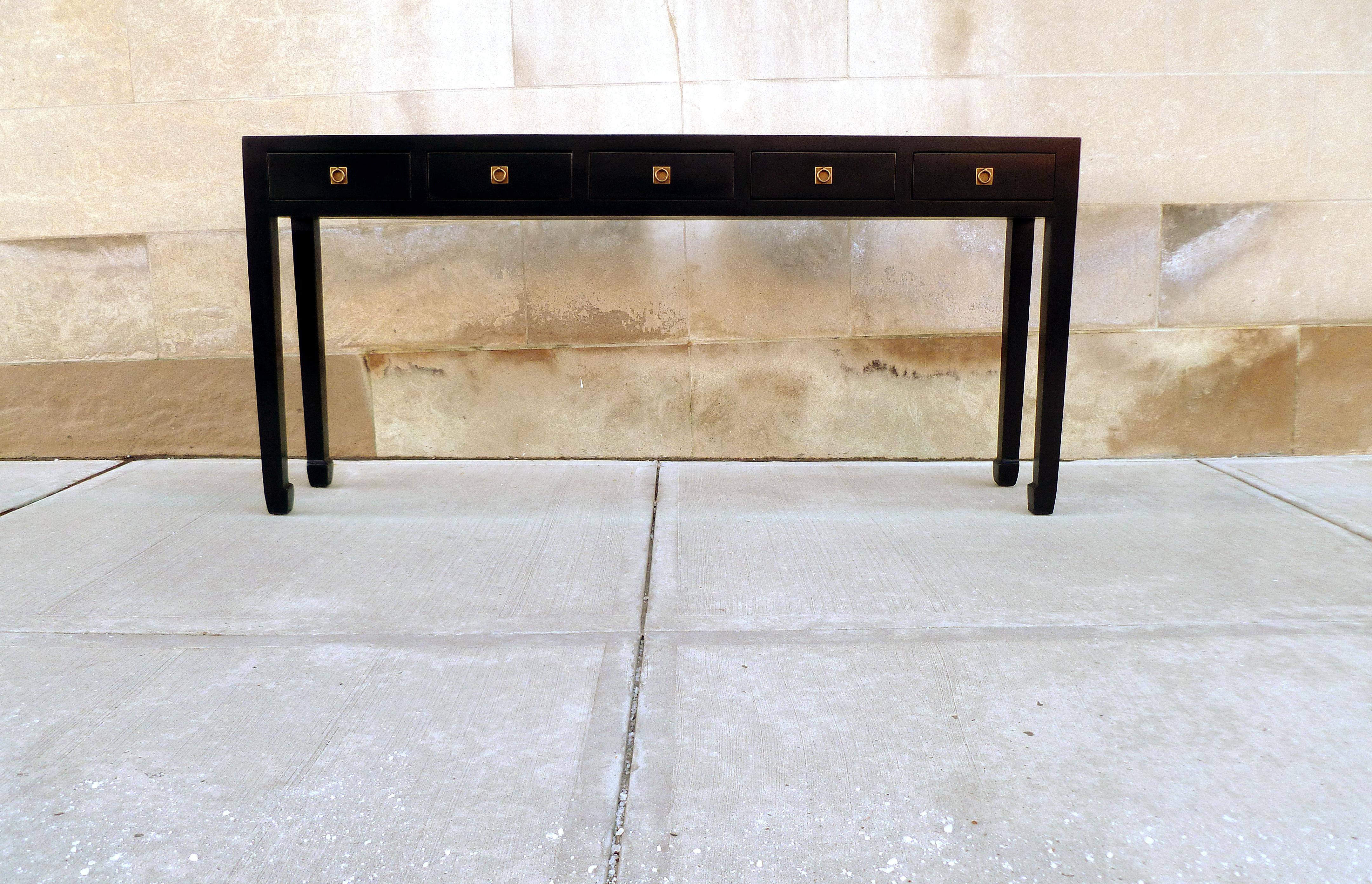 Elegant black lacquer console table with five drawers, brass fitting. Simple form and beautiful color. We carry fine quality furniture with elegant finished and has been appeared many times in 