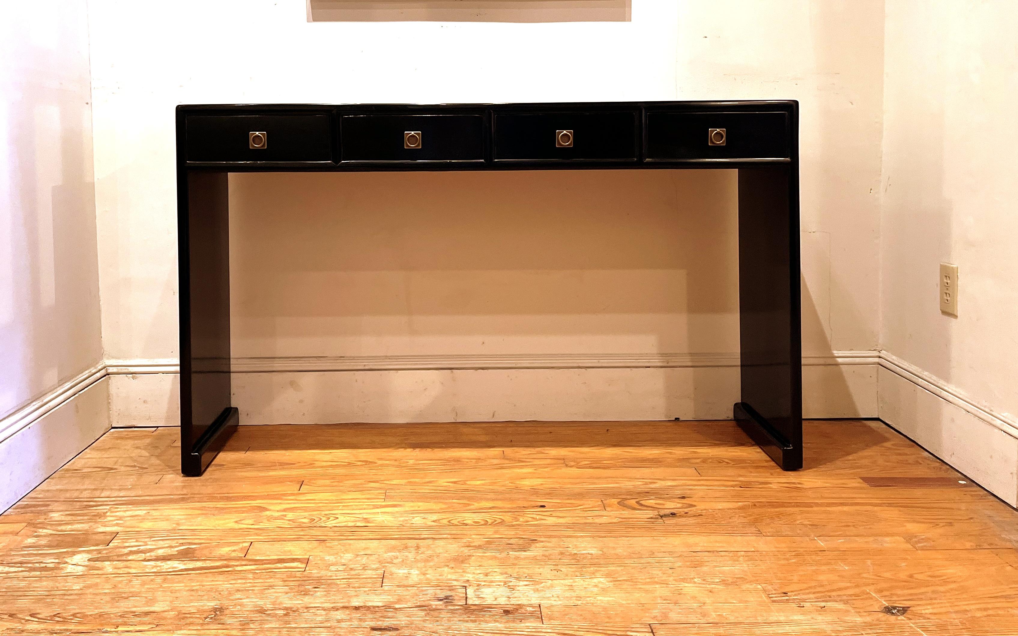 
Fine black lacquer console table with four drawers, waterfall legs, brass fitting, elegant and simple form, beautiful lines. We carry fine quality furniture with elegant finished and has been appeared many times in 