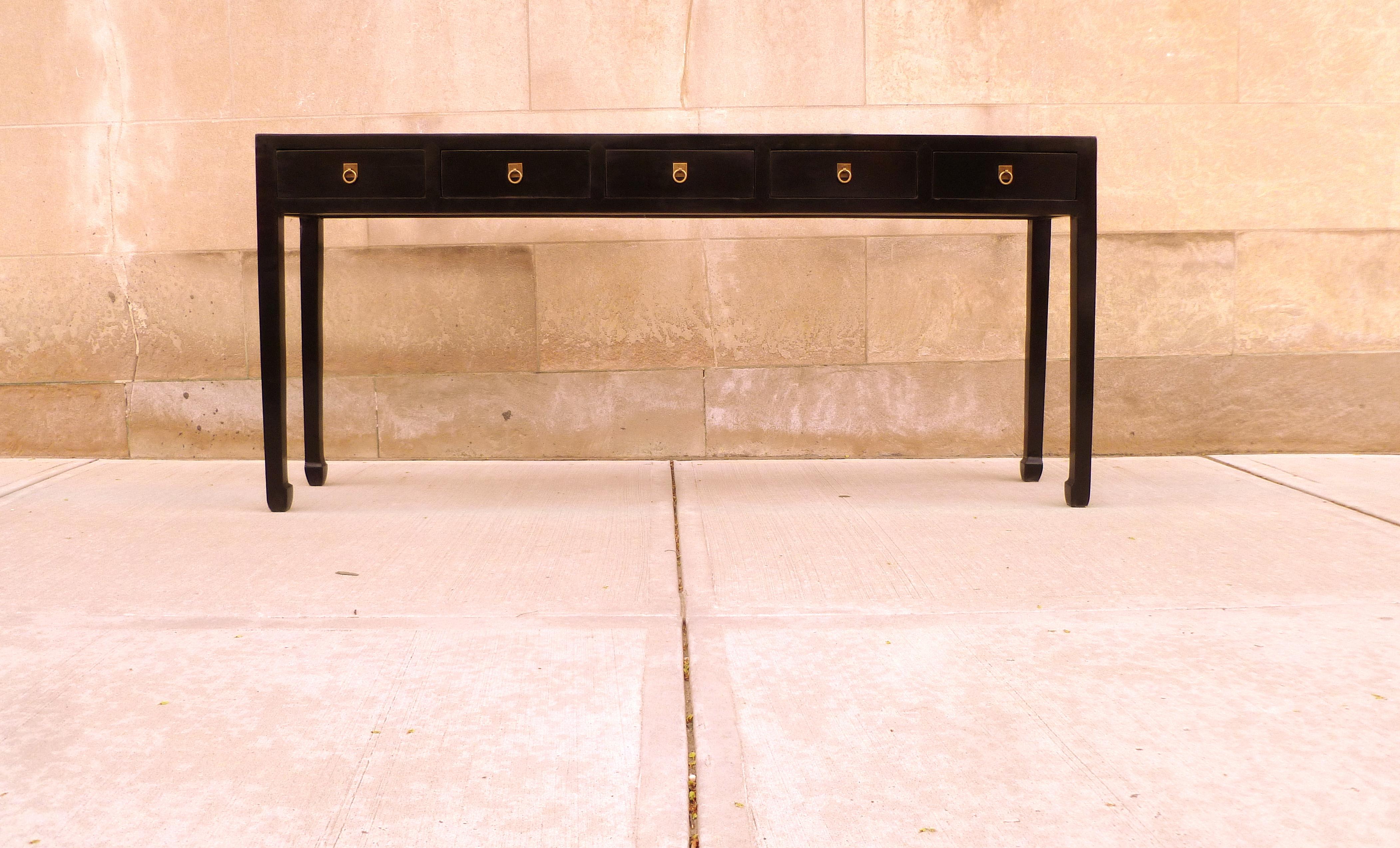 Elegant black lacquer console table with five drawers, brass fitting. Simple form and beautiful color. We carry fine quality furniture with elegant finished and has been appeared many times in 