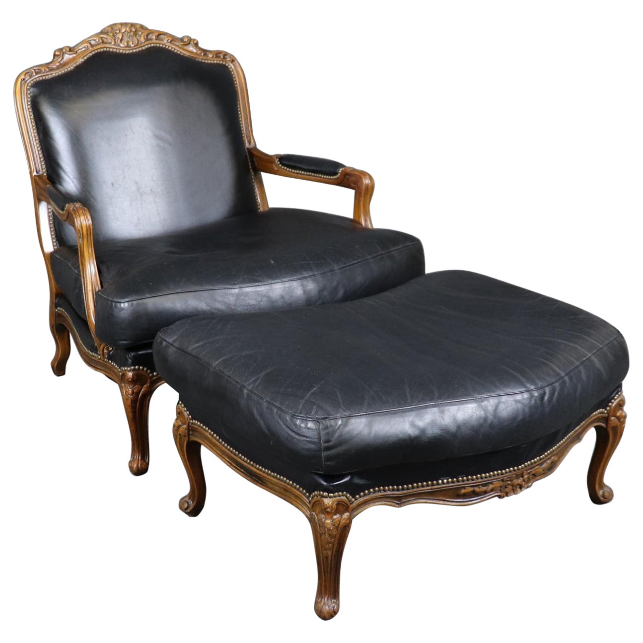 Fine Black Leather Carved French Louis XV Style Bergere Chair and Ottoman