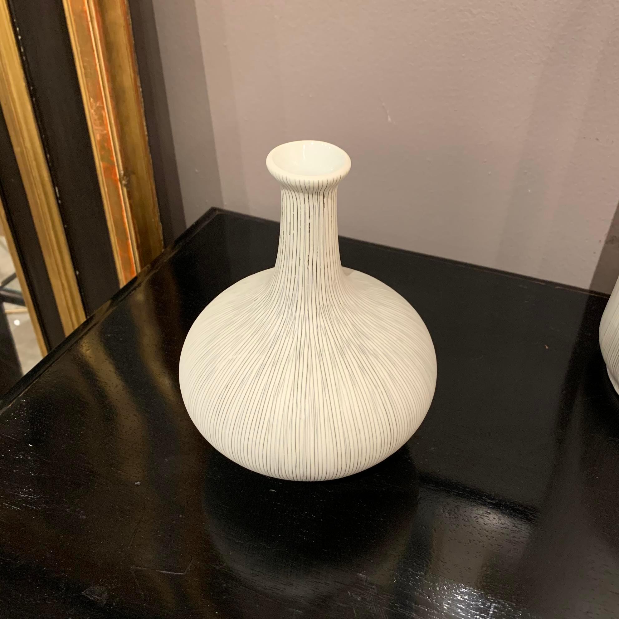 Contemporary Danish design white porcelain vase with fine black stripes.
Long narrow neck with small opening.
Part of a collection of Danish design vases.