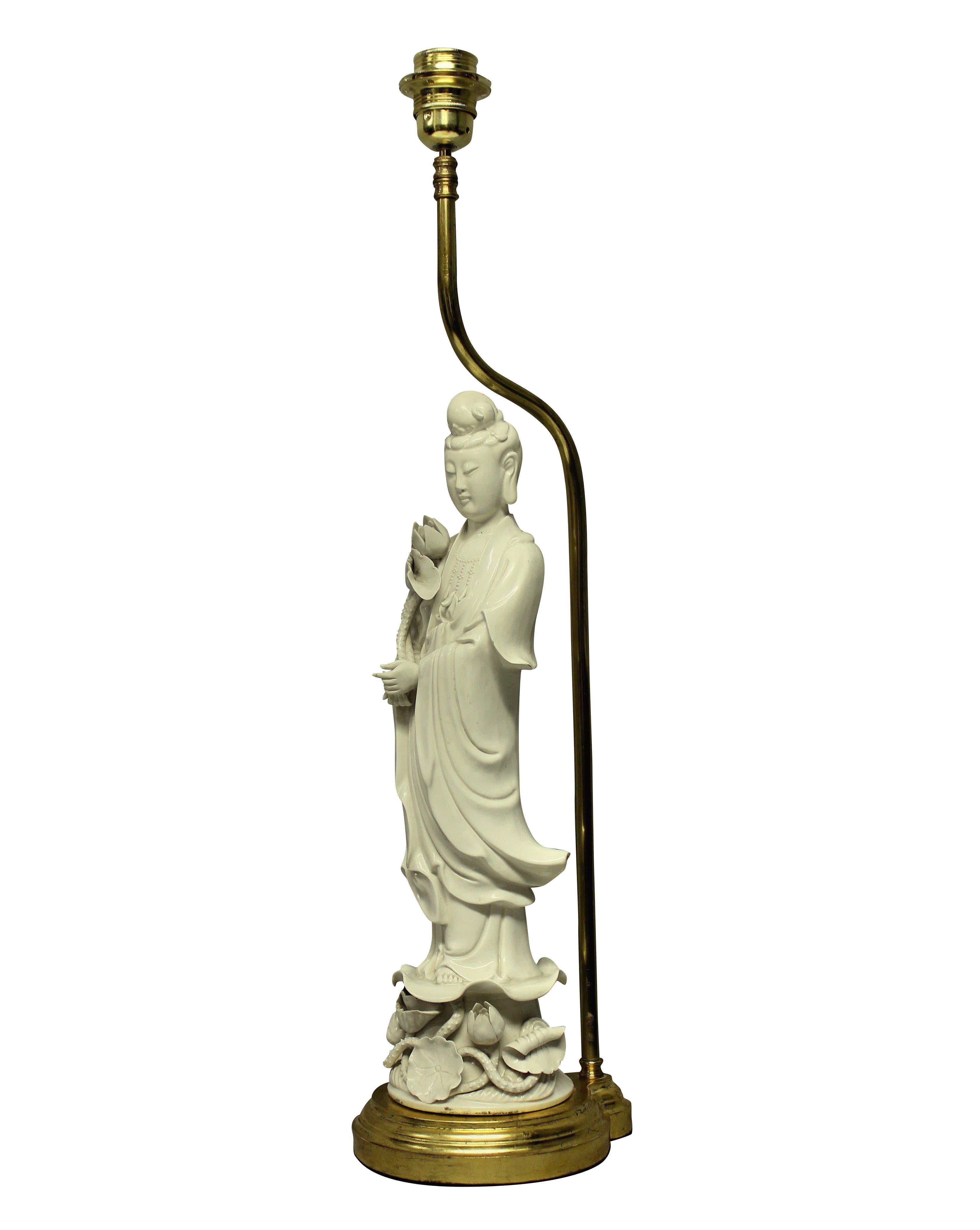 A fine French blanc de chine porcelain table lamp in the oriental manner. Depicting a Chinese lady standing upon a water gilded base.
