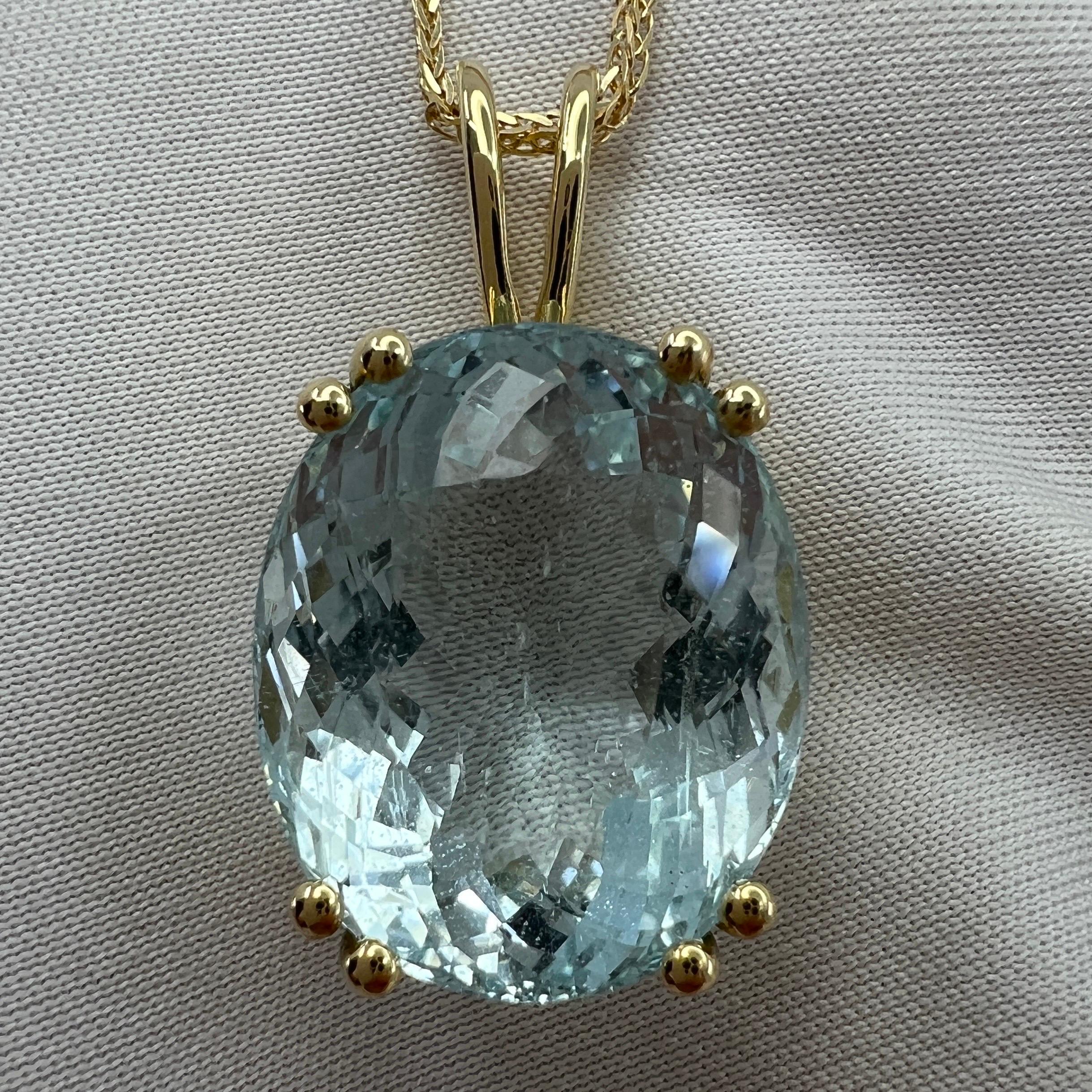 Fine Natural Blue Aquamarine Pendant Necklace.

Large 17.68 carat aquamarine with a stunning bright blue colour set in a fine 18k yellow gold solitaire pendant.
The aquamarine has an excellent fancy oval cut showing lots of brightness and light