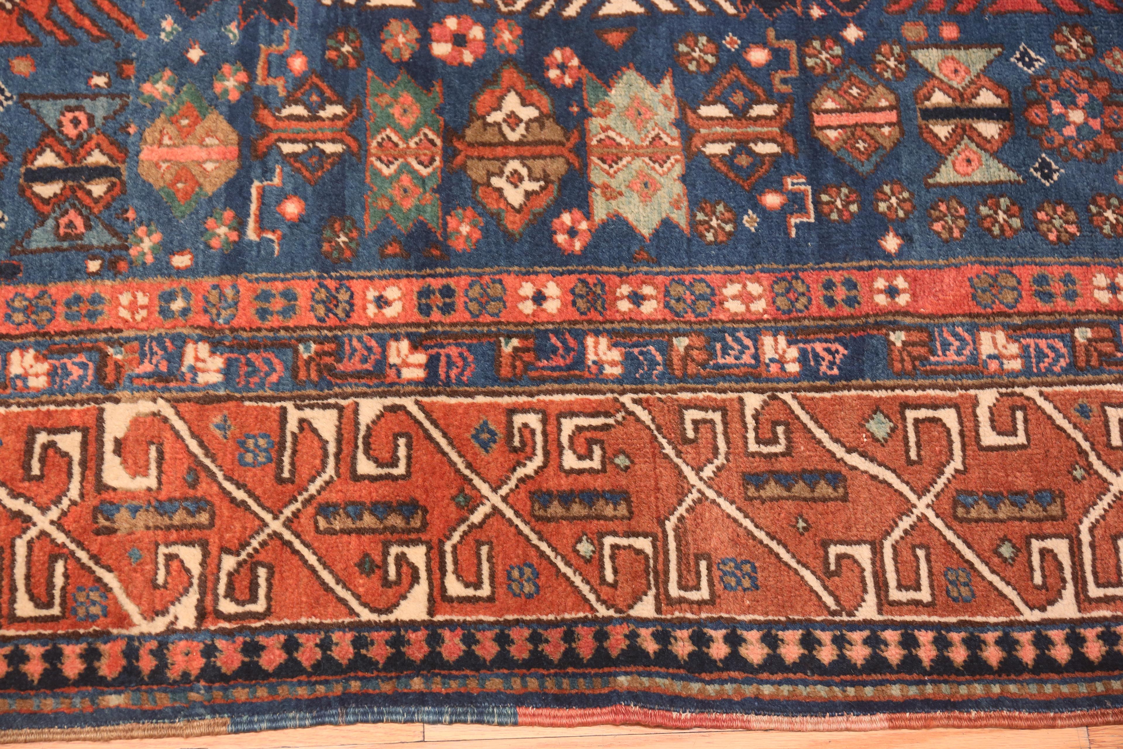 A fine Blue Background Antique Persian Heriz Rug, country of origin / rug type: antique Persian rugs, date circa 1920. Size: 6 ft 8 in x 9 ft 8 in (2.03 m x 2.95 m)

