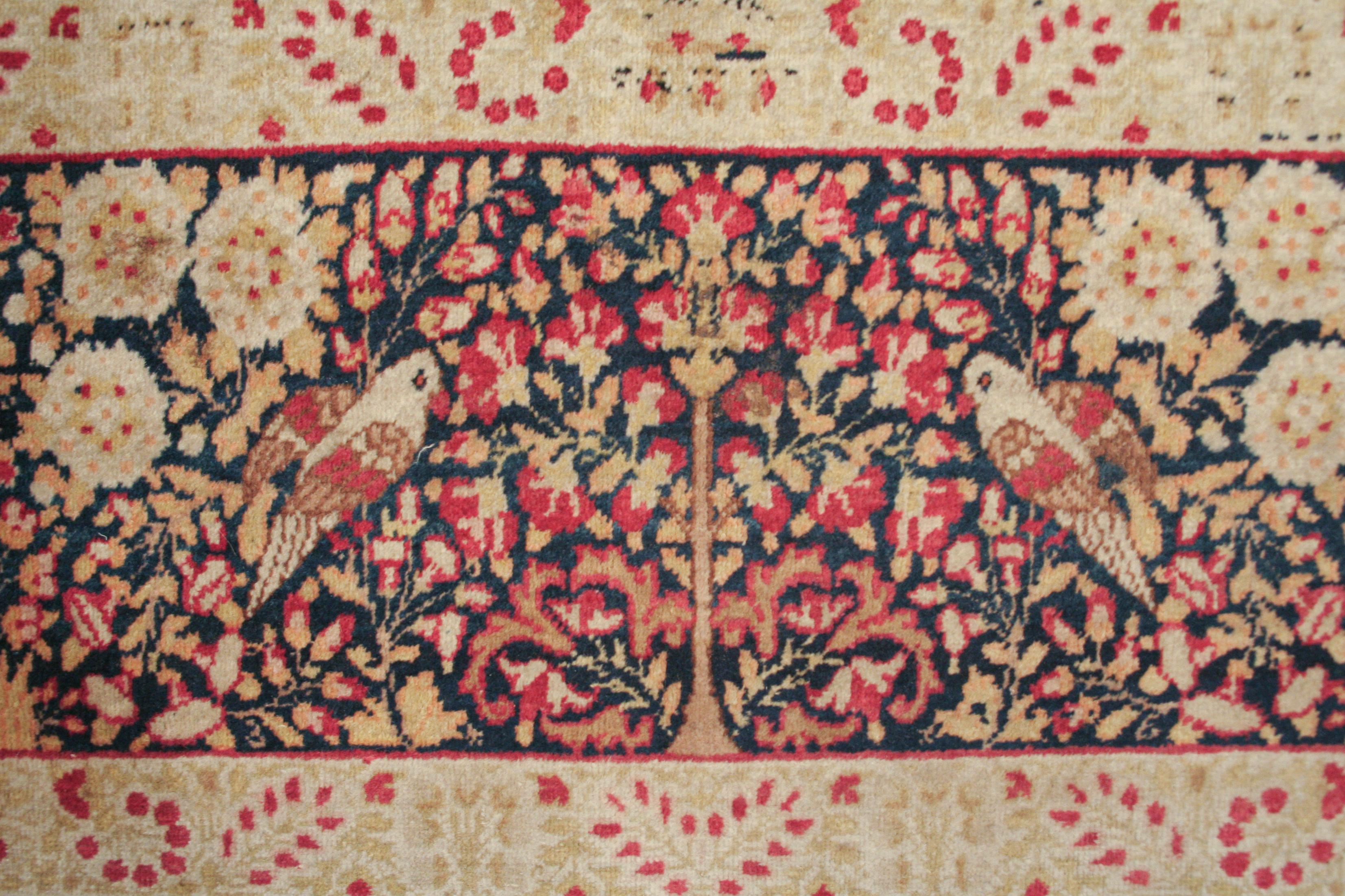 Azero Tappeto Millefleurs Kirman antico con fondo blu pregiato in vendita