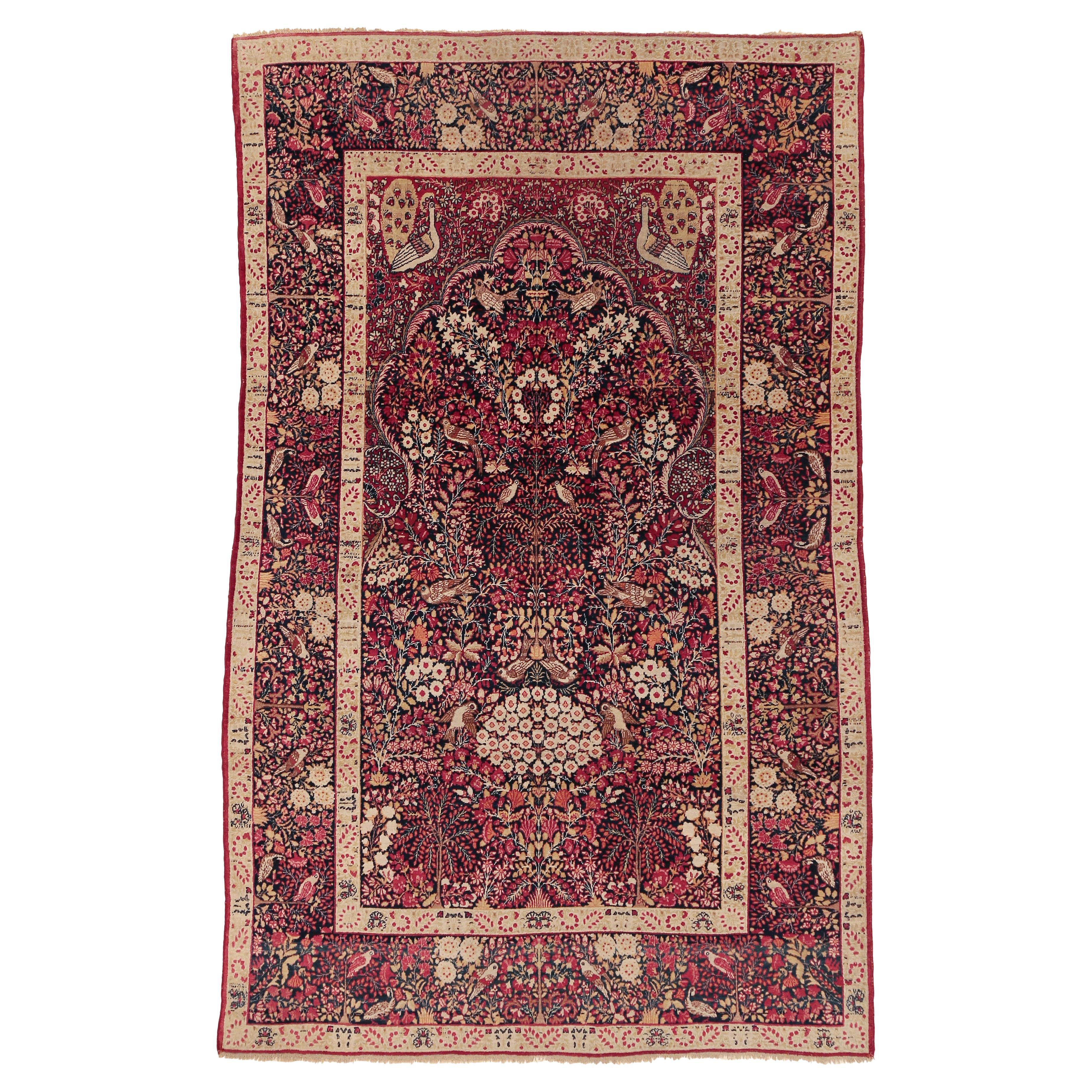 Tappeto Millefleurs Kirman antico con fondo blu pregiato in vendita