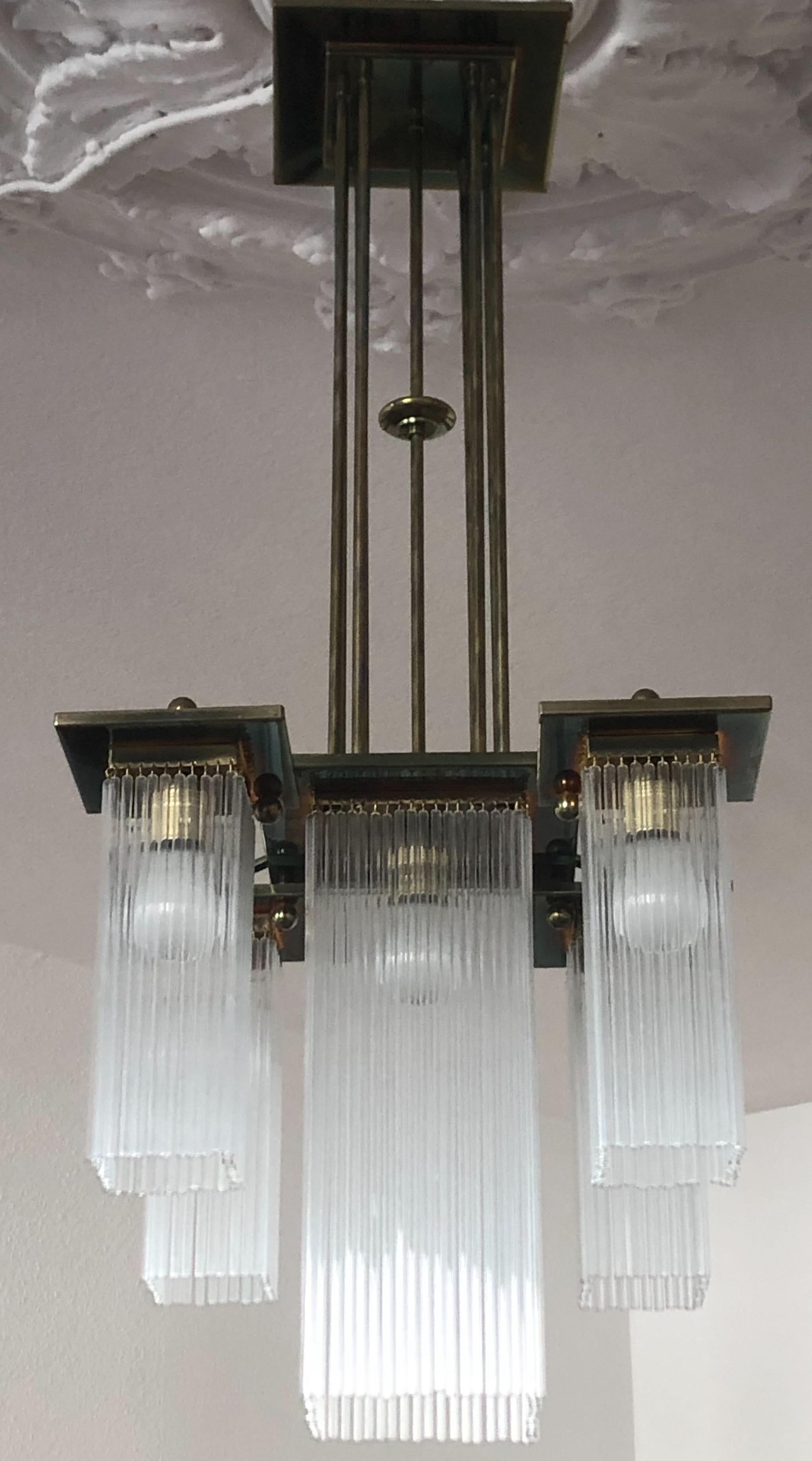 A beautiful and very elegant 5-light brass and glass chandelier in the style of Koloman Moser and Otto Wagner,
circa 1990s, Austria, Vienna.
The chandelier needs E27 standard screw bulbs for illuminate.
Excellent condition.
