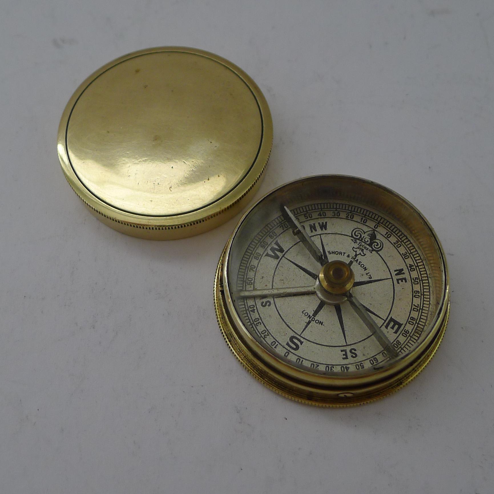A very fine English brass cased compass, professionally cleaned and polished restoring it to it's former glory.  The face signed Short & Mason / London together with the brand name 