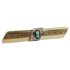 Fine brooch with tourmaline and diamonds in 14k yellow gold
