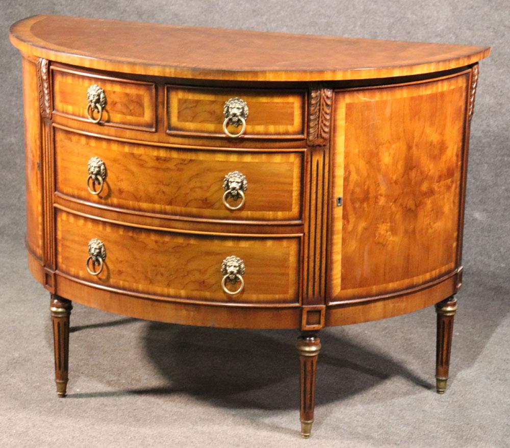 This is a beautiful and decorative commode with lion head hardware. The commode dates to the 1960s era and is in good original condition with minor signs of wear and a small scratch which we can detail. The cmmmode measures 48 inches wide x 24 deep