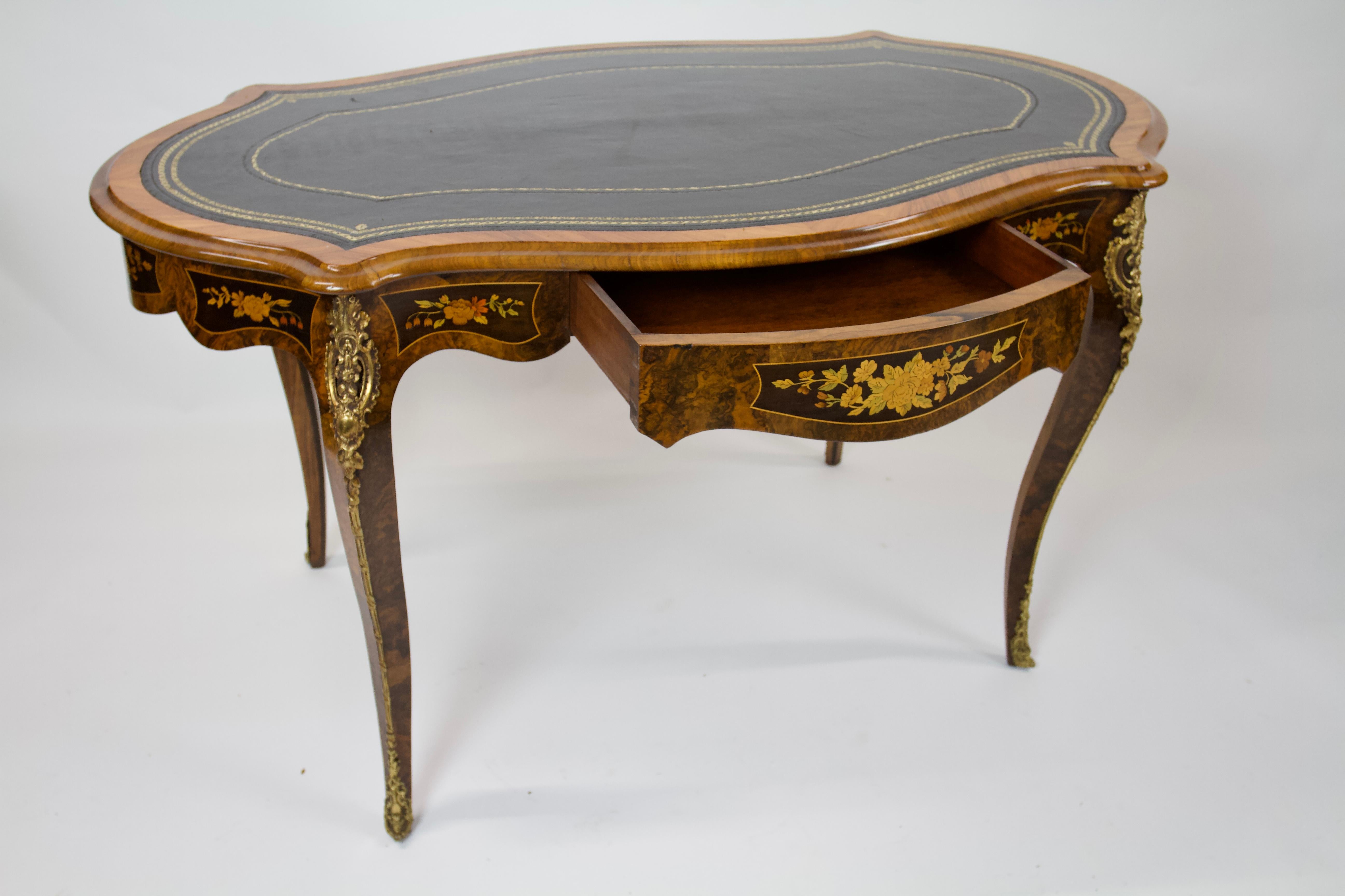 Fine C19TH  French Burr Walnut & Marquetry Bureau Plat /Writing Table
Black Leather inset top, gold tooling decoration, 
with Walnut cross banding. thumb mould edge.
Shaped Burr Walnut Frieze, with Marquetry inlay panels
Single Drawer at front with