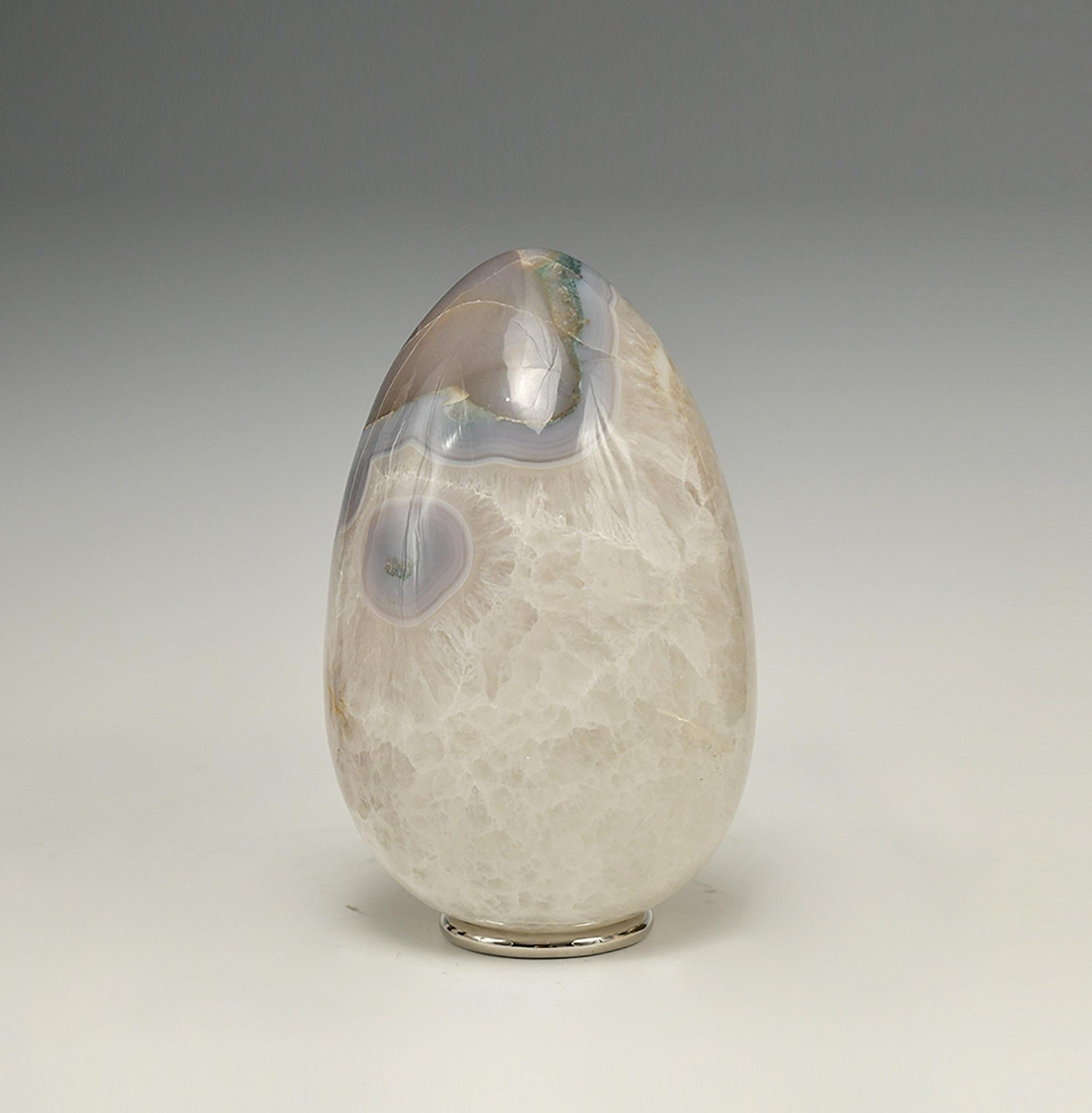 A natural agate sculpture with grotto.
 