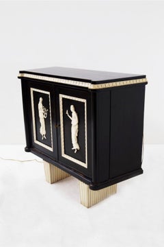 Italian Art Deco-style bar cabinet with elegant carvings and an wood