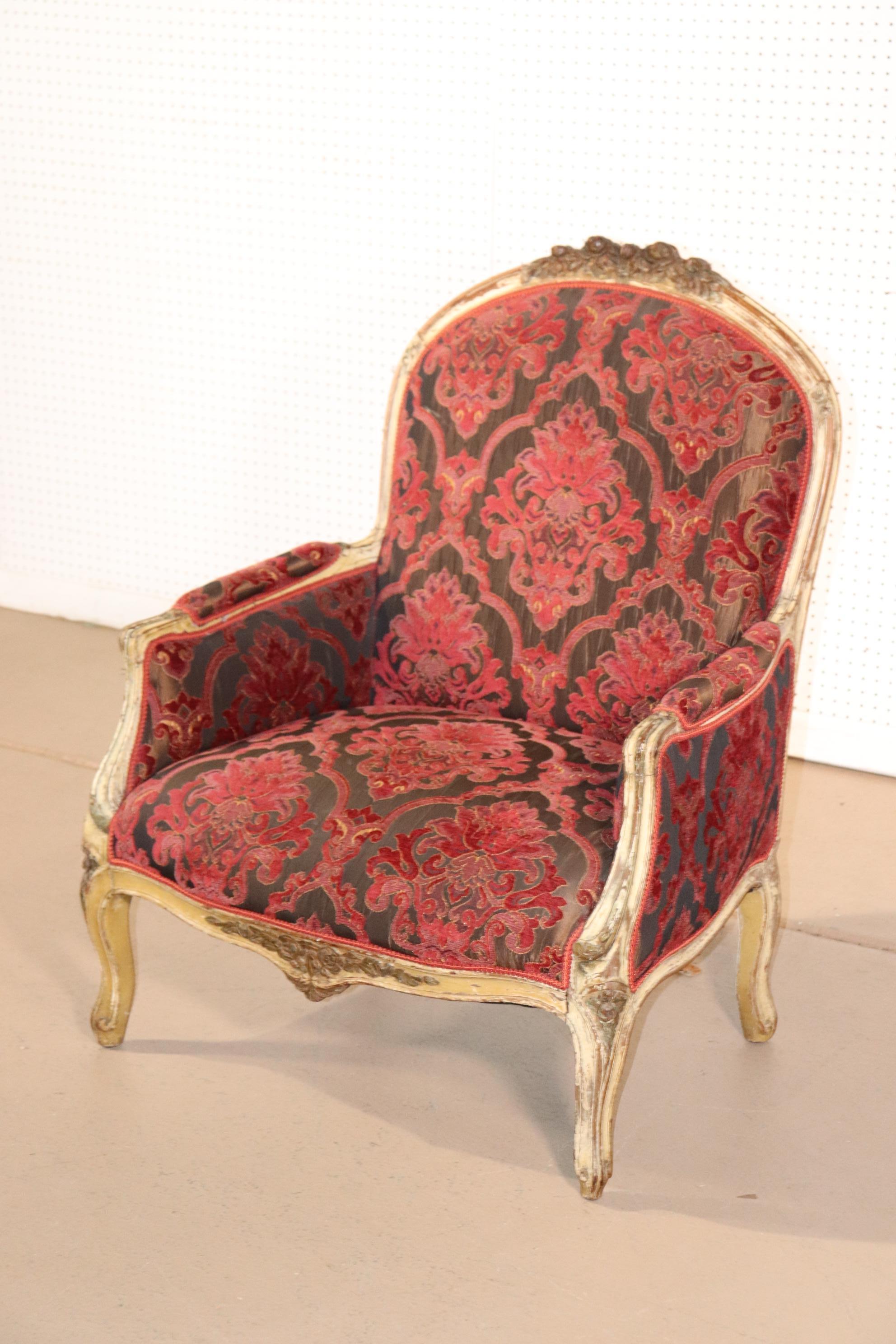 This is a beautiful time-worn paint decorated bergere. The chair is in very good antique condition. The chair measures 41 tall x 32 wide x 31 deep x 17 seat height.