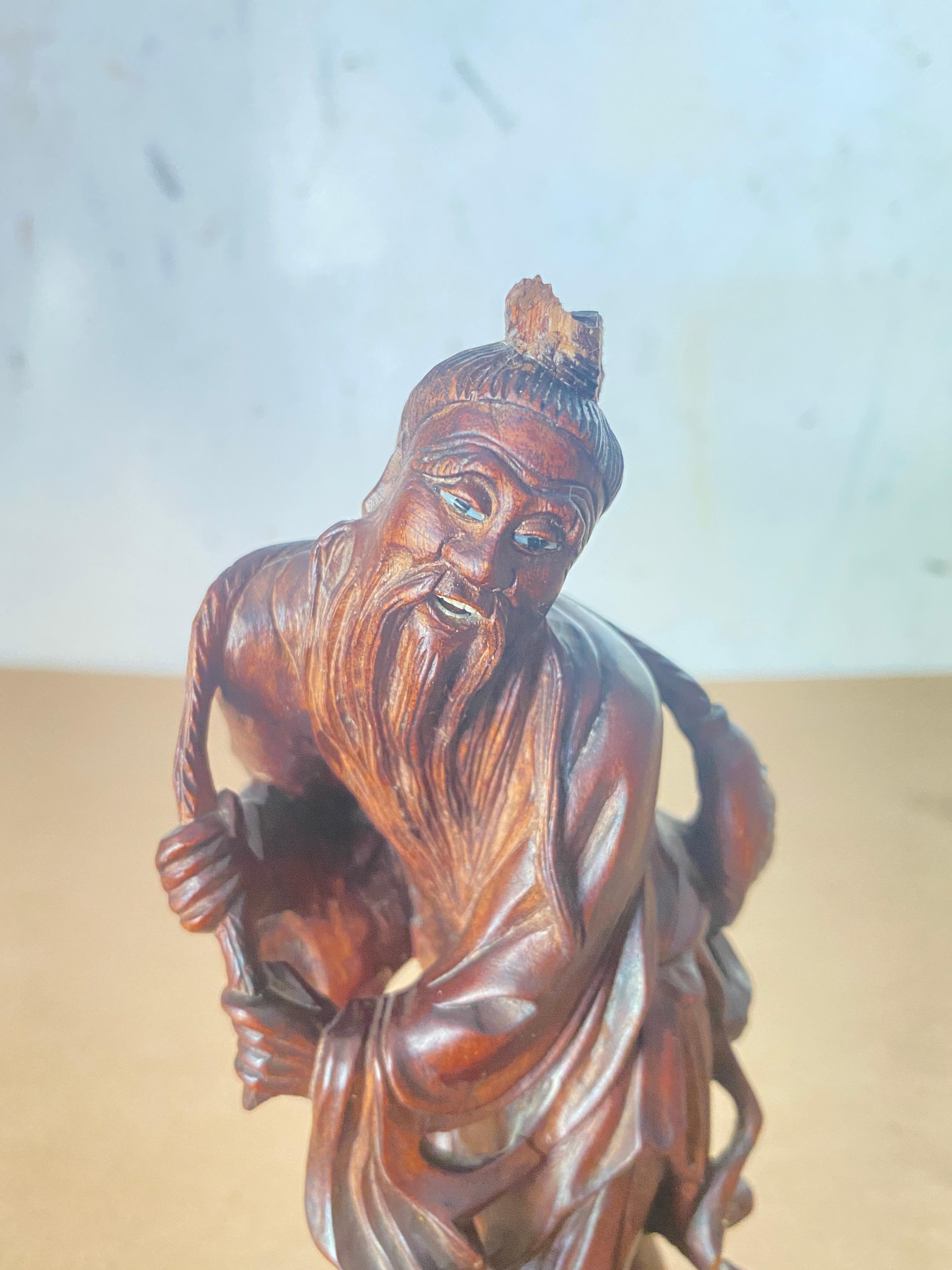 chinese fisherman statue meaning