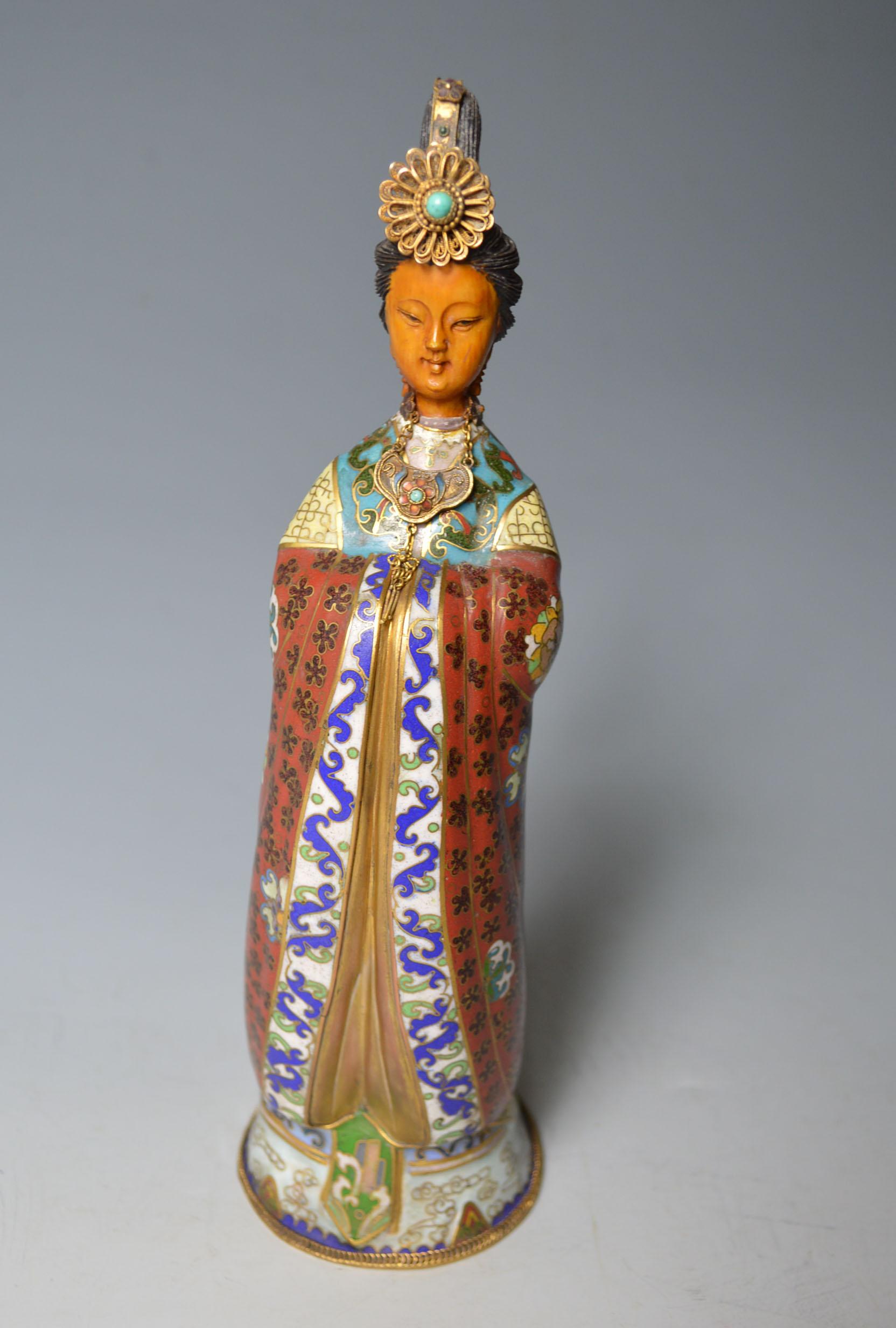 A fine Chinese Cloisonne figure
A superb finely made Chinese Cloisonne figure of a noble lady or princess standing in long sumptuously decorated robes
wearing a diadem and necklace
Period 1920s-1930s
Condition: Fine
Measures: Height 10 inches ,