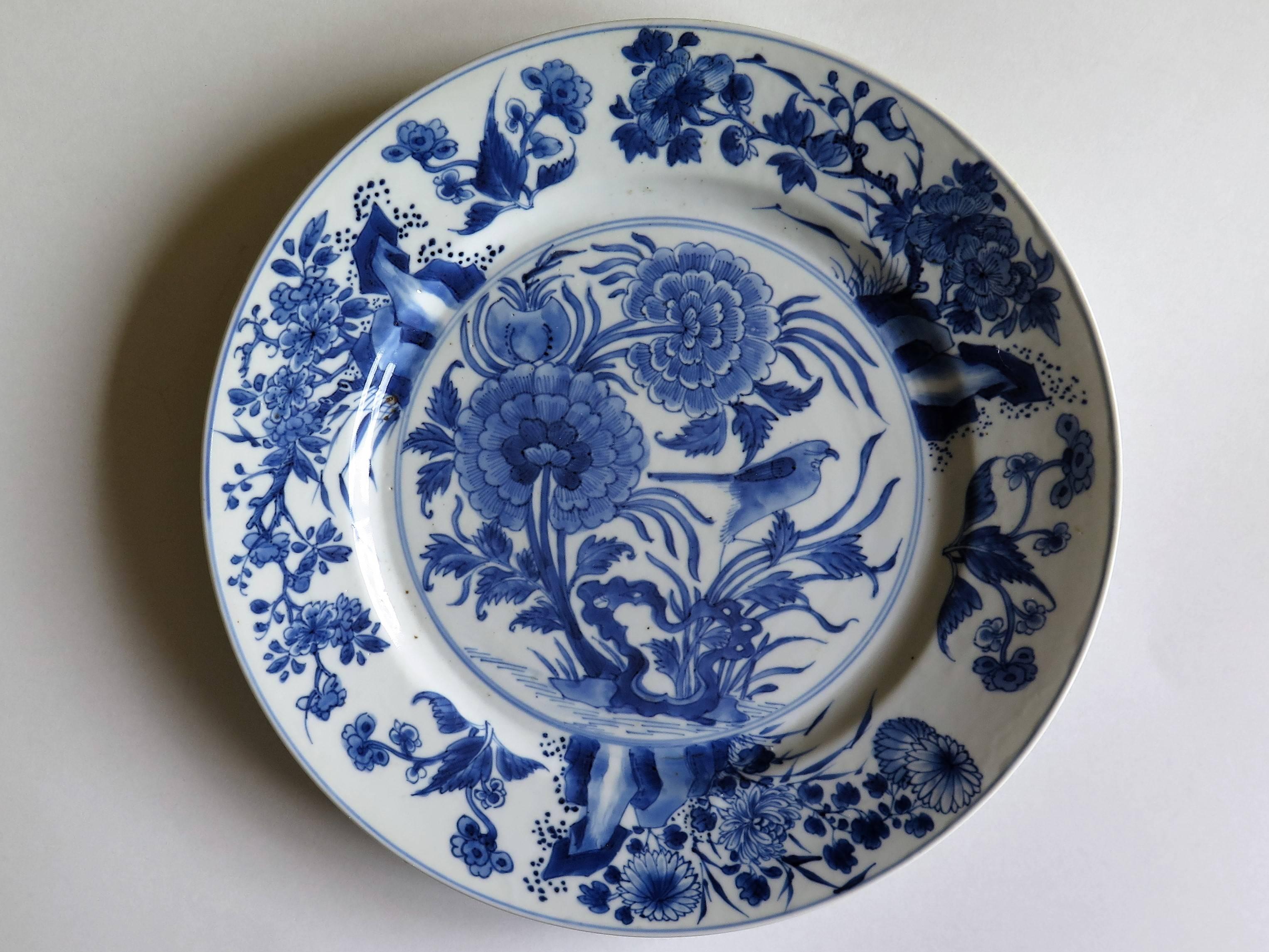 This is a beautifully hand-painted Chinese porcelain blue and white plate from the Qing, Kangxi period, 1662-1722.

The plate is finely potted with a carefully cut base rim and a lovely rich glassy, very light blue glaze.

The plate is carefully