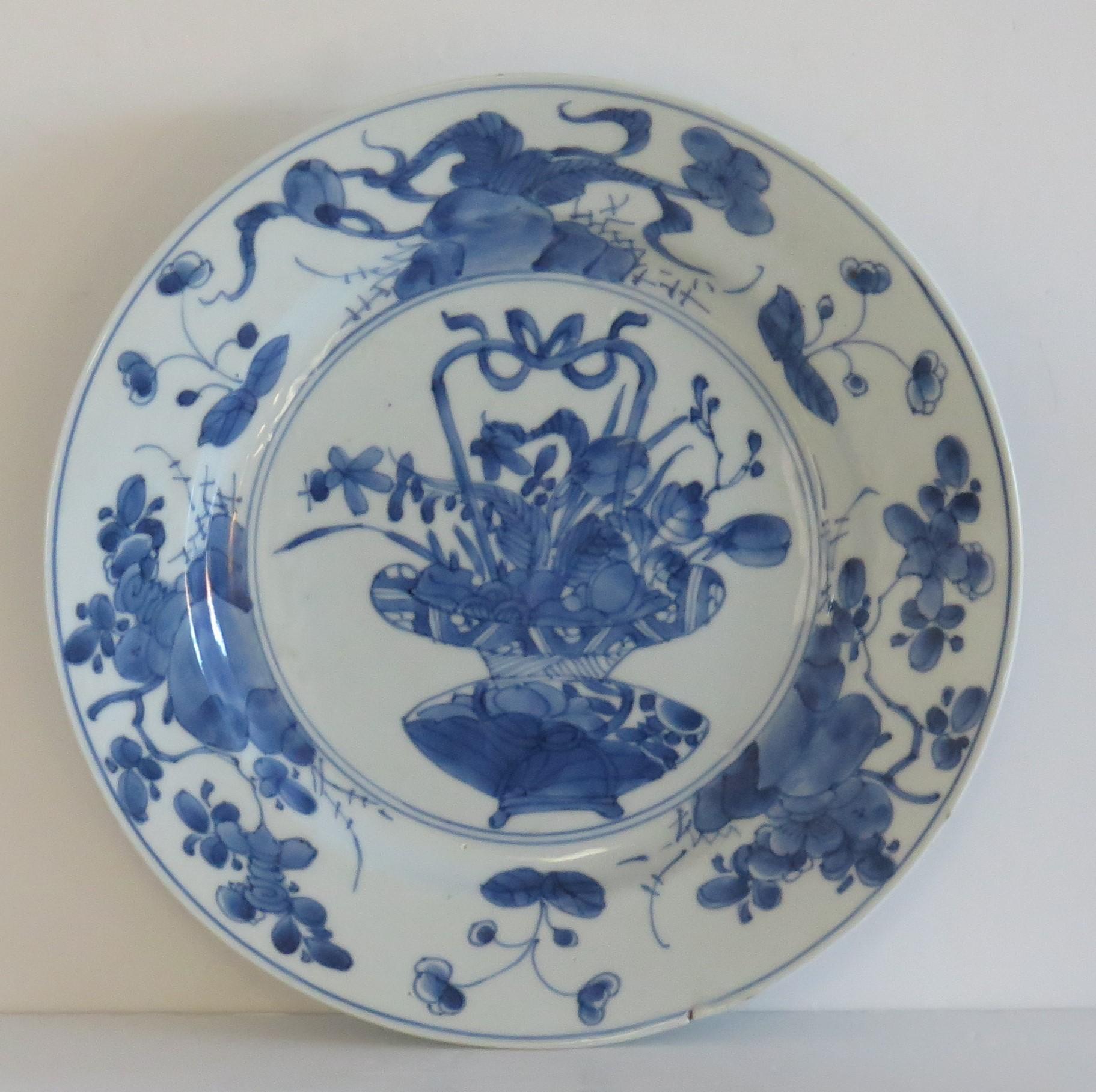 This is a beautifully hand-painted Chinese porcelain blue and white plate from the Qing, Kangxi period, 1662-1722.

The plate is finely potted with a carefully cut base rim and a lovely rich glassy, very light blue glaze.

The plate is