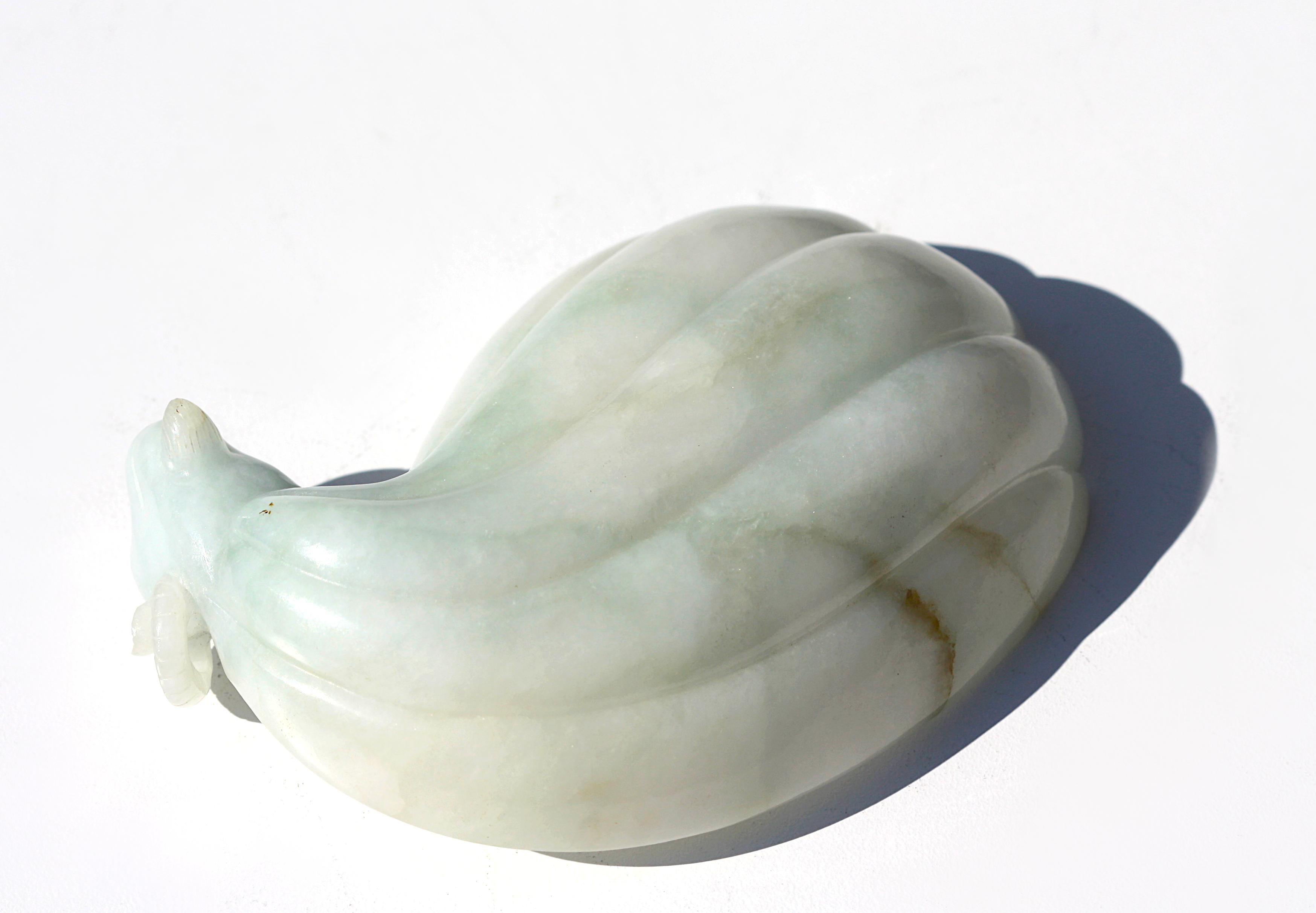
Fine Chinese Ram Headed White Jadeite Brush Washer
The transparent white jadeite with hues of emerald green and lavender with slight veins of russet, the lobed oval coup terminating in a ram head, on a finely shaped and carved hardwood
