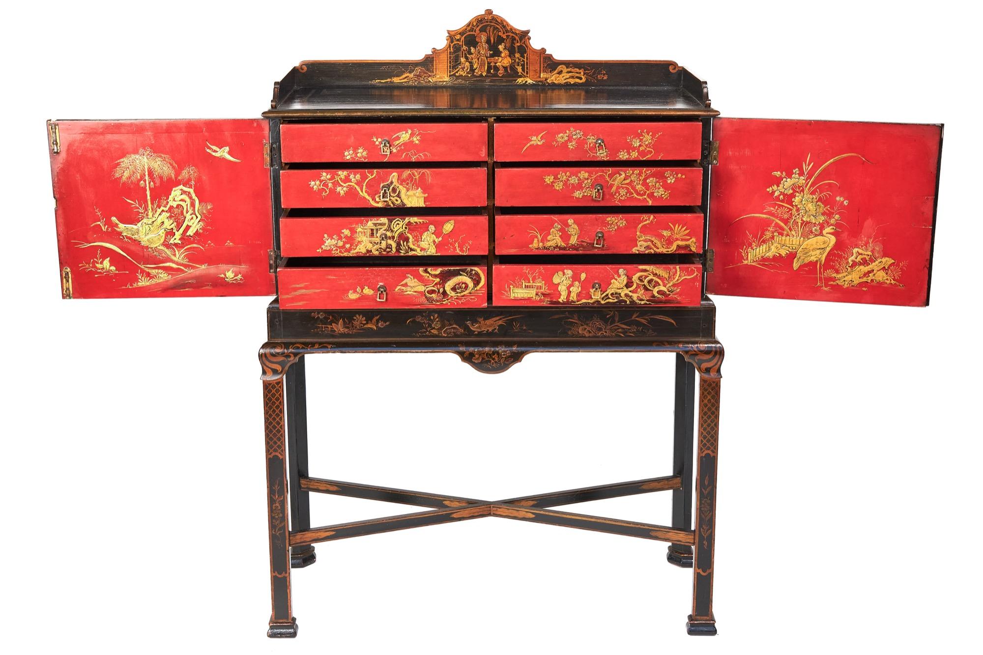 Fine Chinoiserie Decorated fitted 8 drawer Cabinet on stand circa 1900
Three Quarter tray top with shaped back depicting:
Interior scene with figures & Foliage,
Two doors, with shaped Chinoiserie decorated panels Depicting:
Figures &