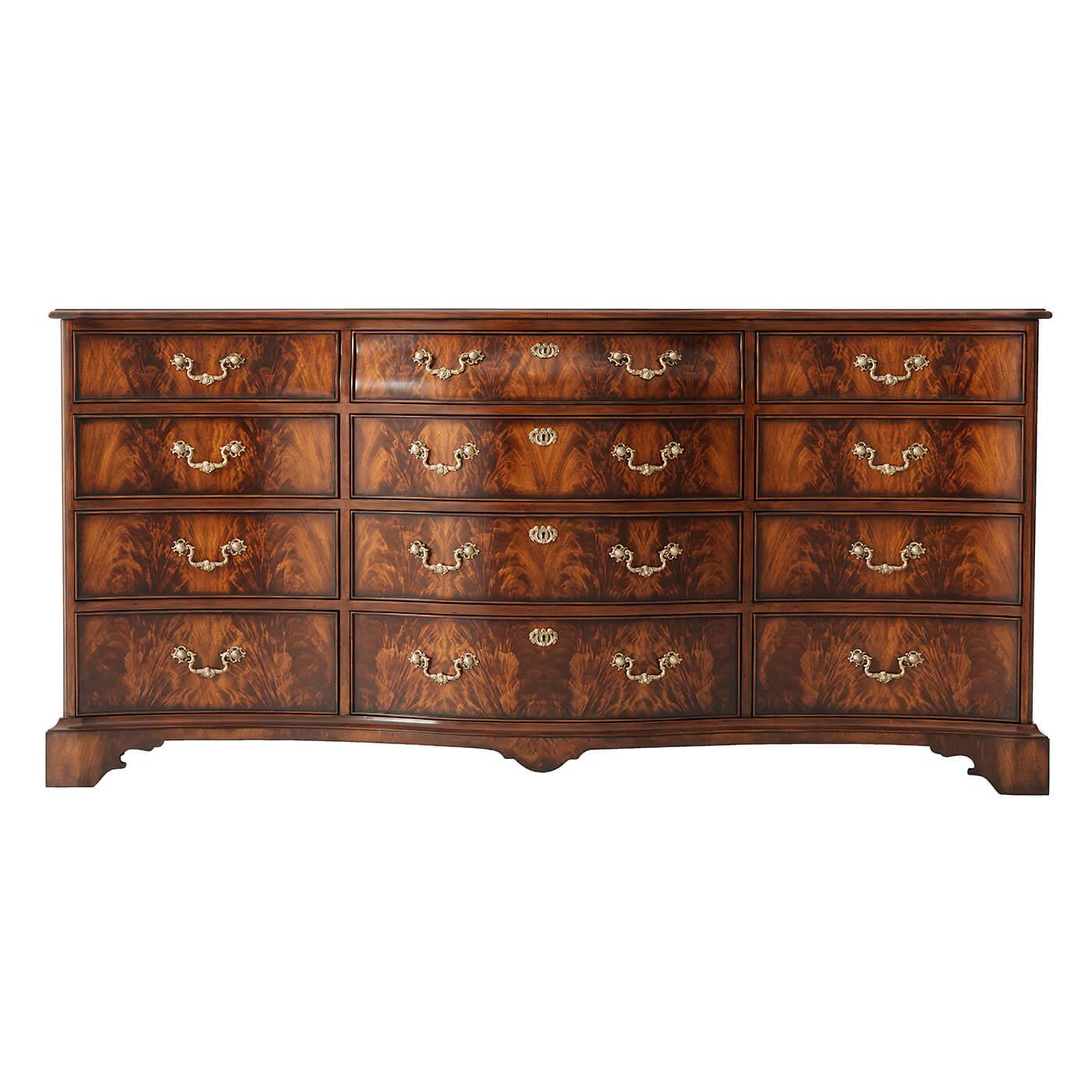 A fine Chippendale style flame mahogany and mahogany serpentine dresser, the molded edge top above an arrangement of twelve bomb and shaped drawers with brass handles and escutcheons, on ogee bracket feet. Inspired by a George III original in the