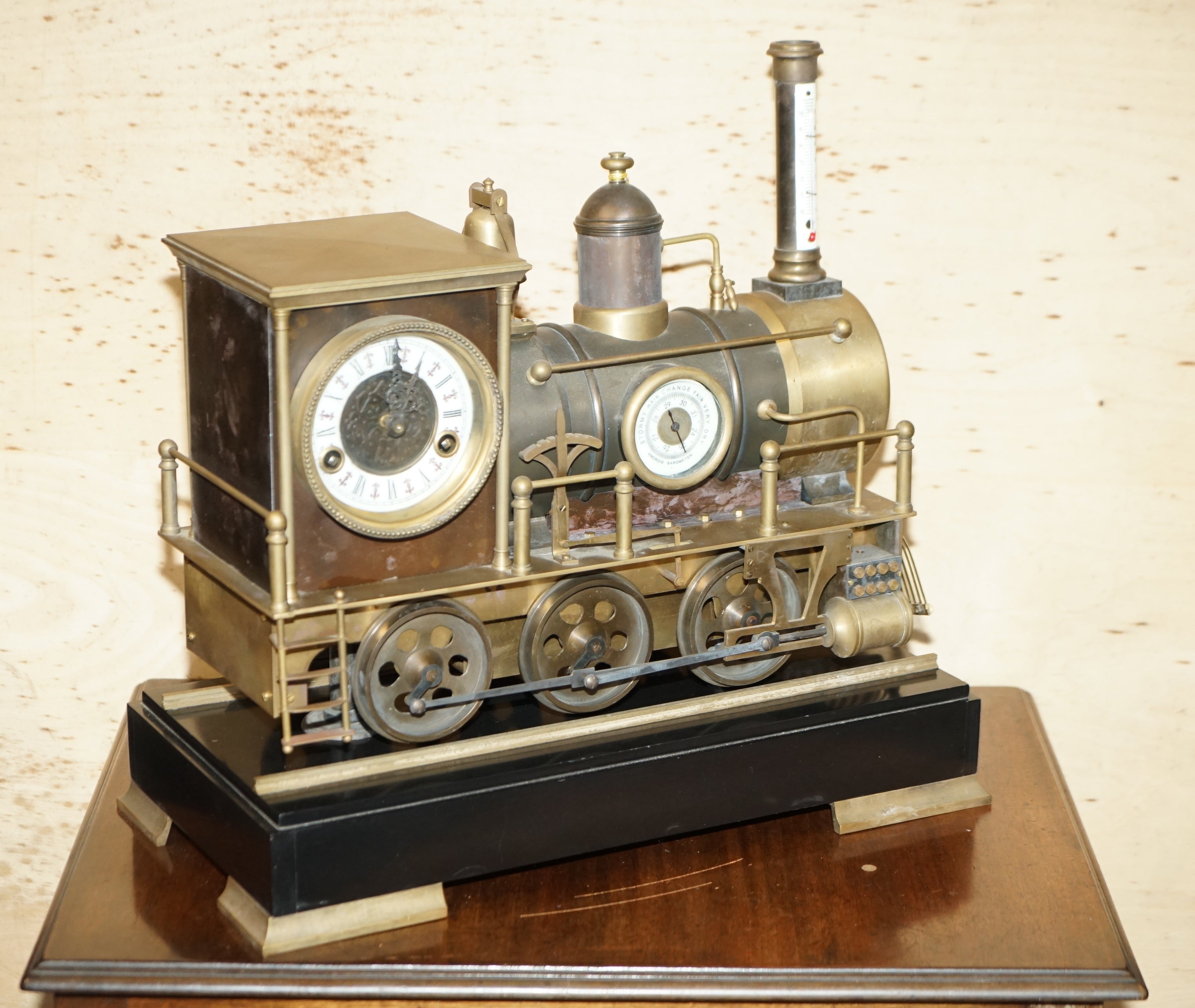 Royal House Antiques

Royal House Antiques is delighted to offer for sale this very fine and highly collectable Antique circa 1895 French Automaton Industrial Locomotive moving gilt bronze clock sitting on top of a solid marble base with bronze