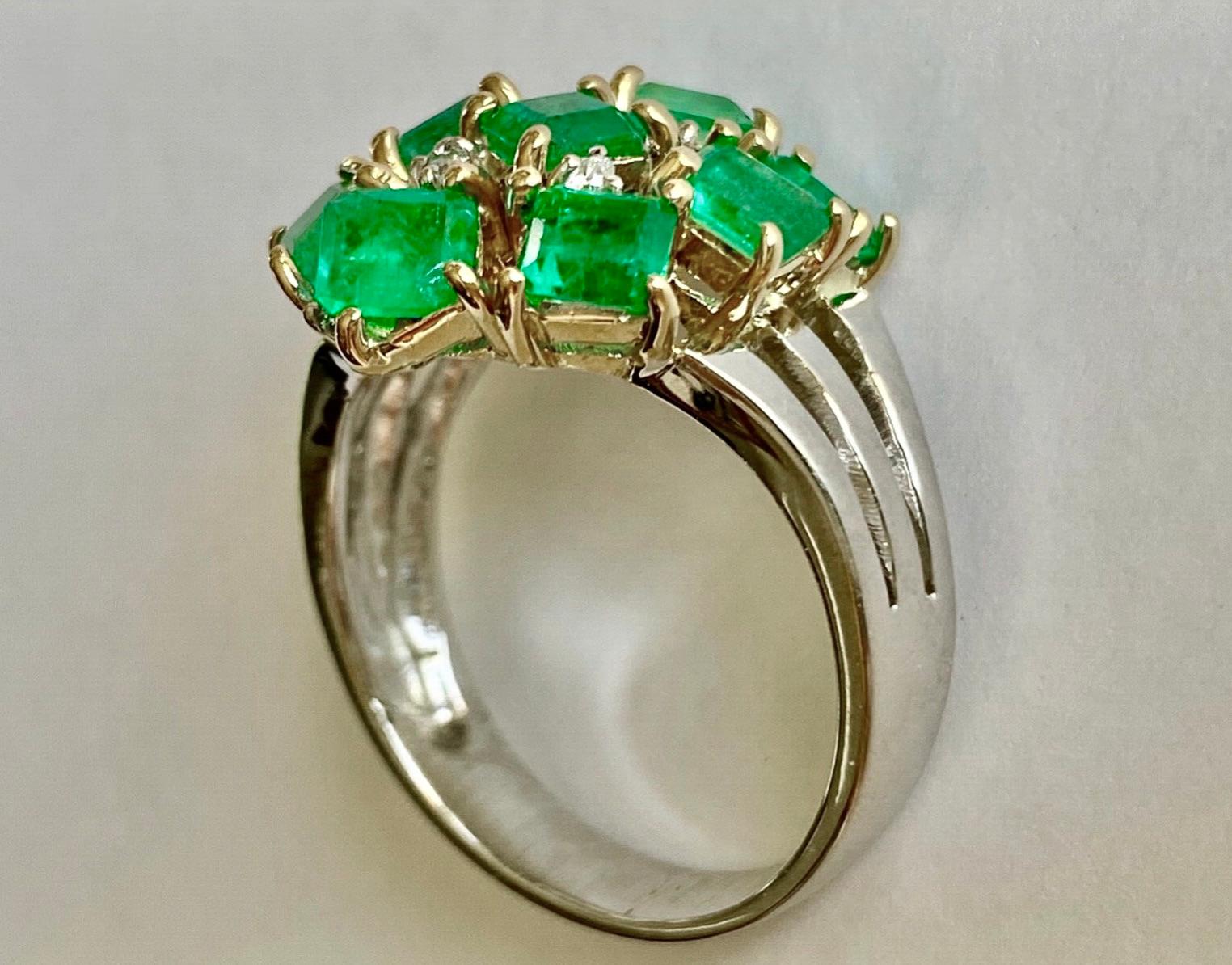 Estate Retro style 4.20 carats natural Colombian emerald, emerald cut, cluster cocktail ring 18K yellow gold handmade setting from our Workshop.
Primary Stone: Natural Colombian Emerald
Shape or Cut: Mix Cut 
Approx Emerald Weight: Over 4.00 Carat