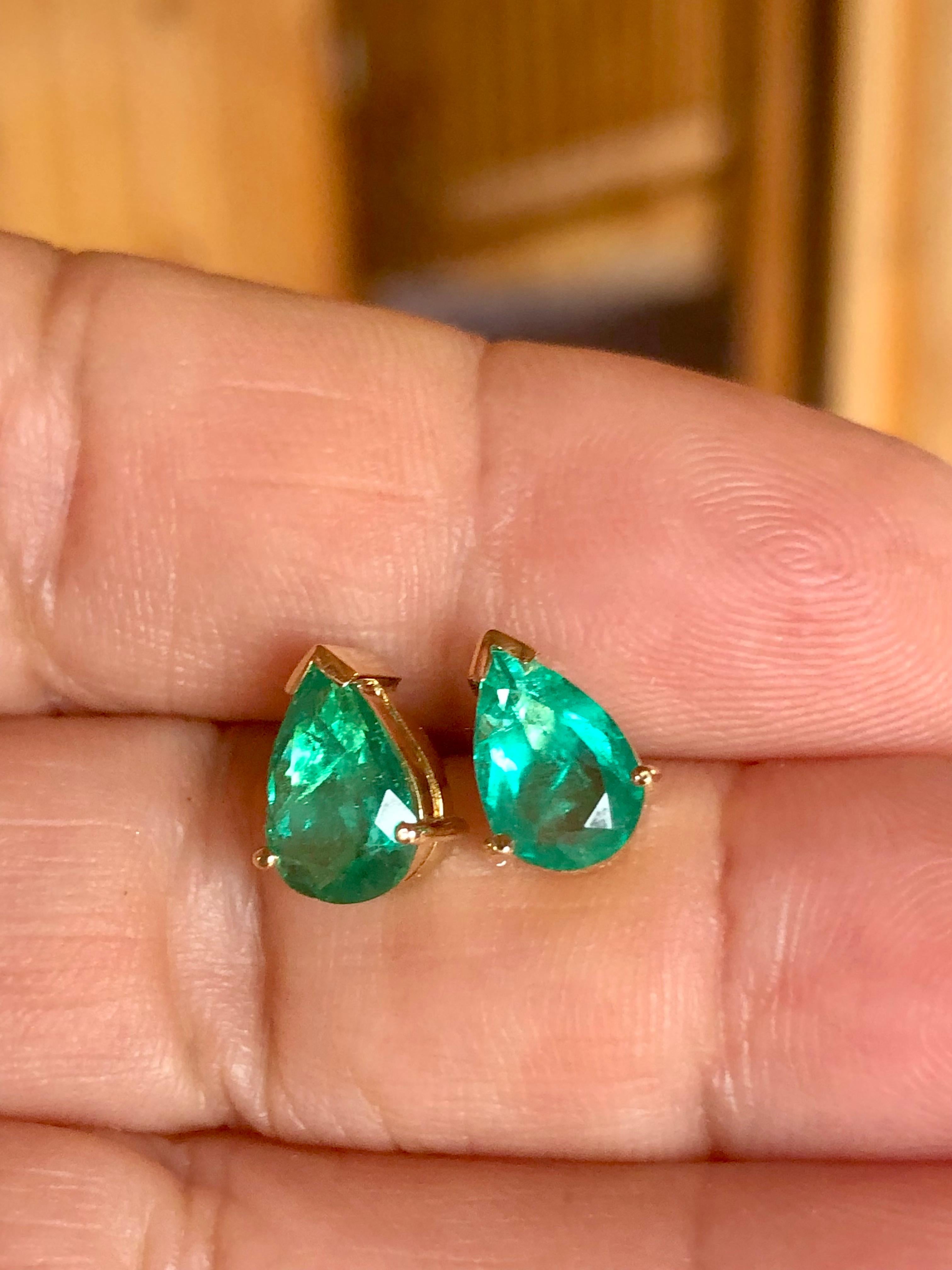 Timeless earrings feature lustrous pear-shaped Colombian Emeralds of AAA+ Fine Quality and Intense color. These earrings are a contemporary classic and will make the perfect addition to any jewelry collection. - Pear-Shape 9.50mmx6.60mm Colombian
