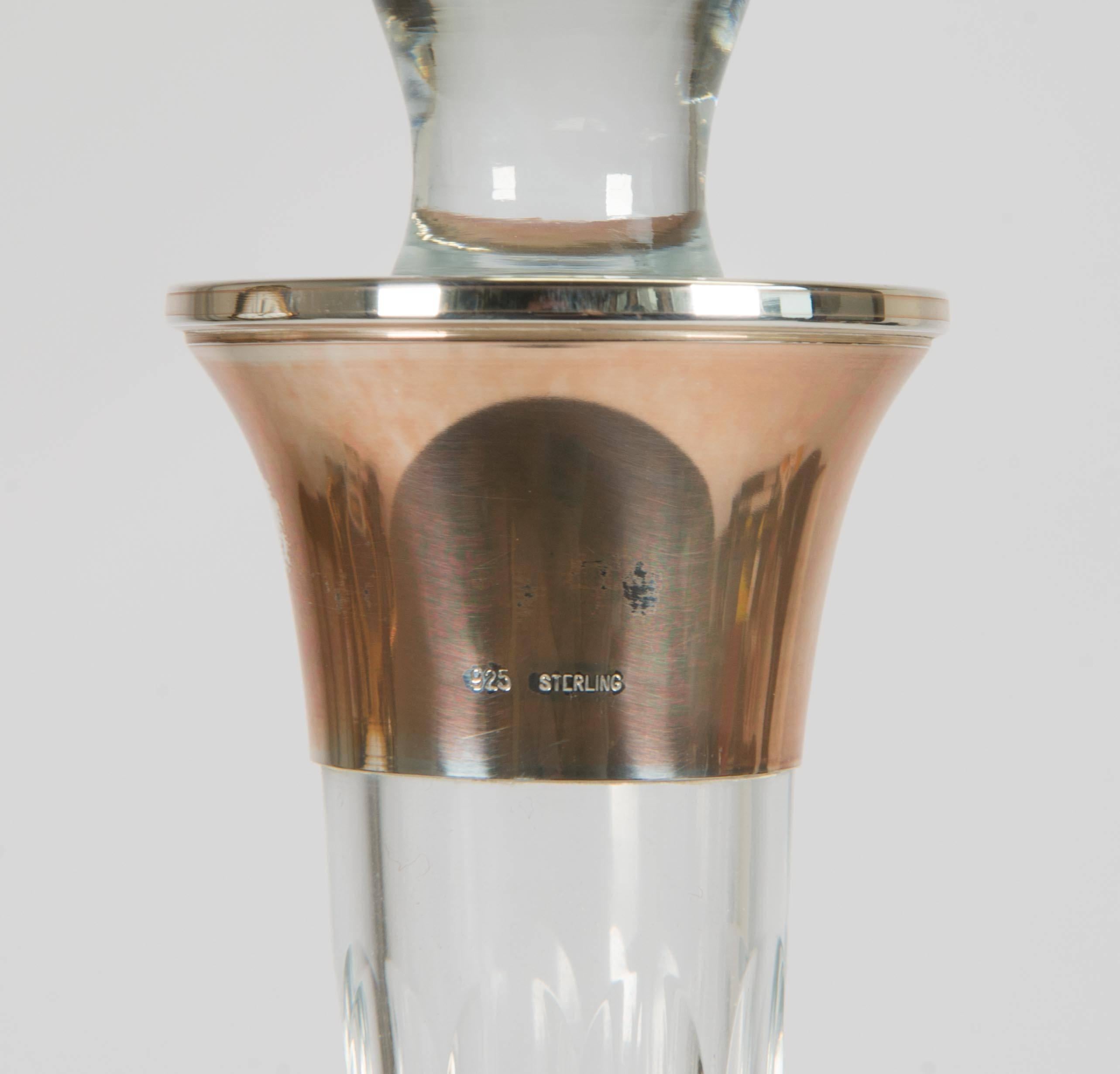 Fine crystal decanter with sterling silver rim.
The rim is hallmarked: 925 sterling.

 