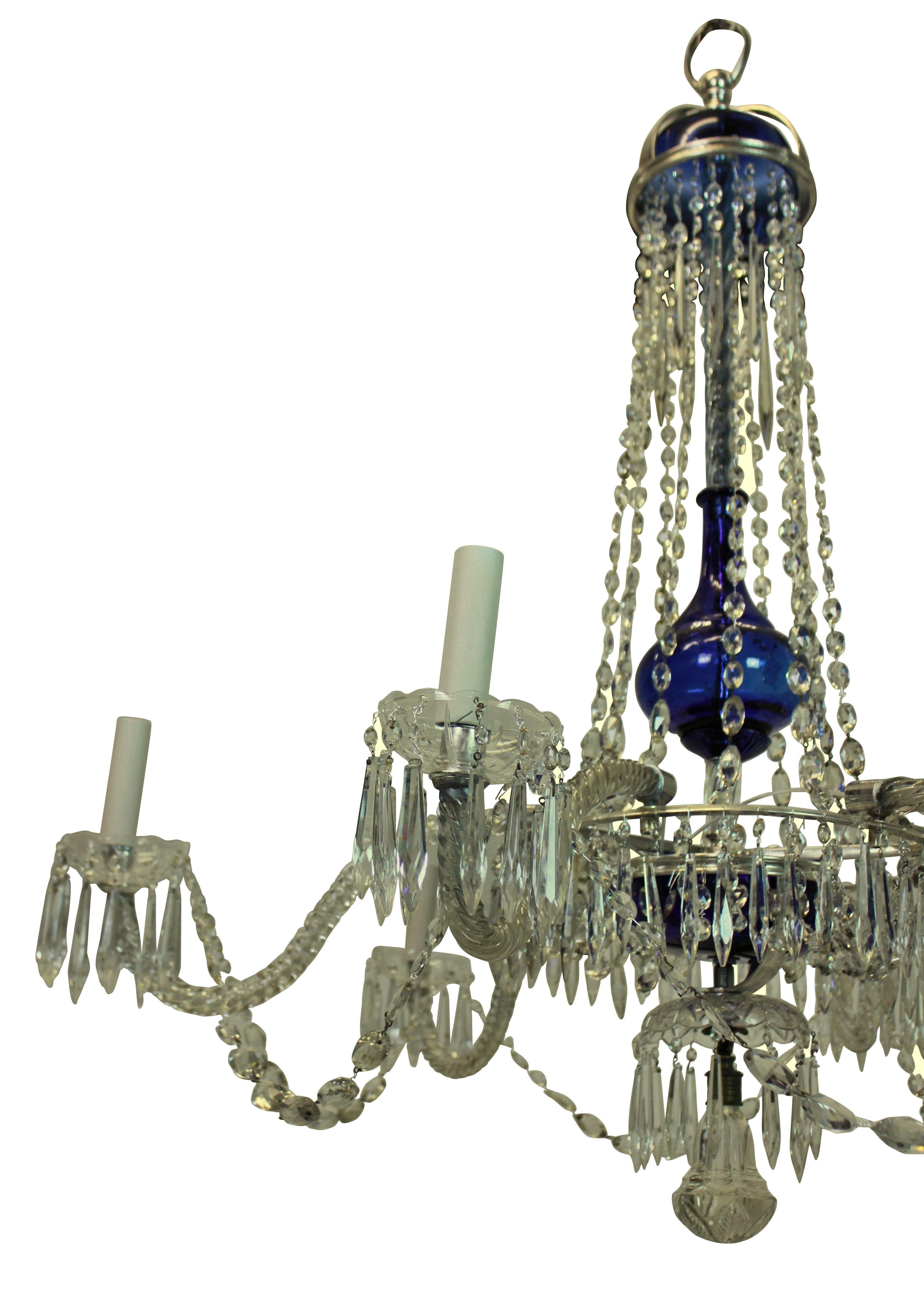 A fine Baltic chandelier with 'Baltic' blue glass and clear cut-glass dressings, arms and pendants. The metal work of silver plate. Six arms in total.
 
  