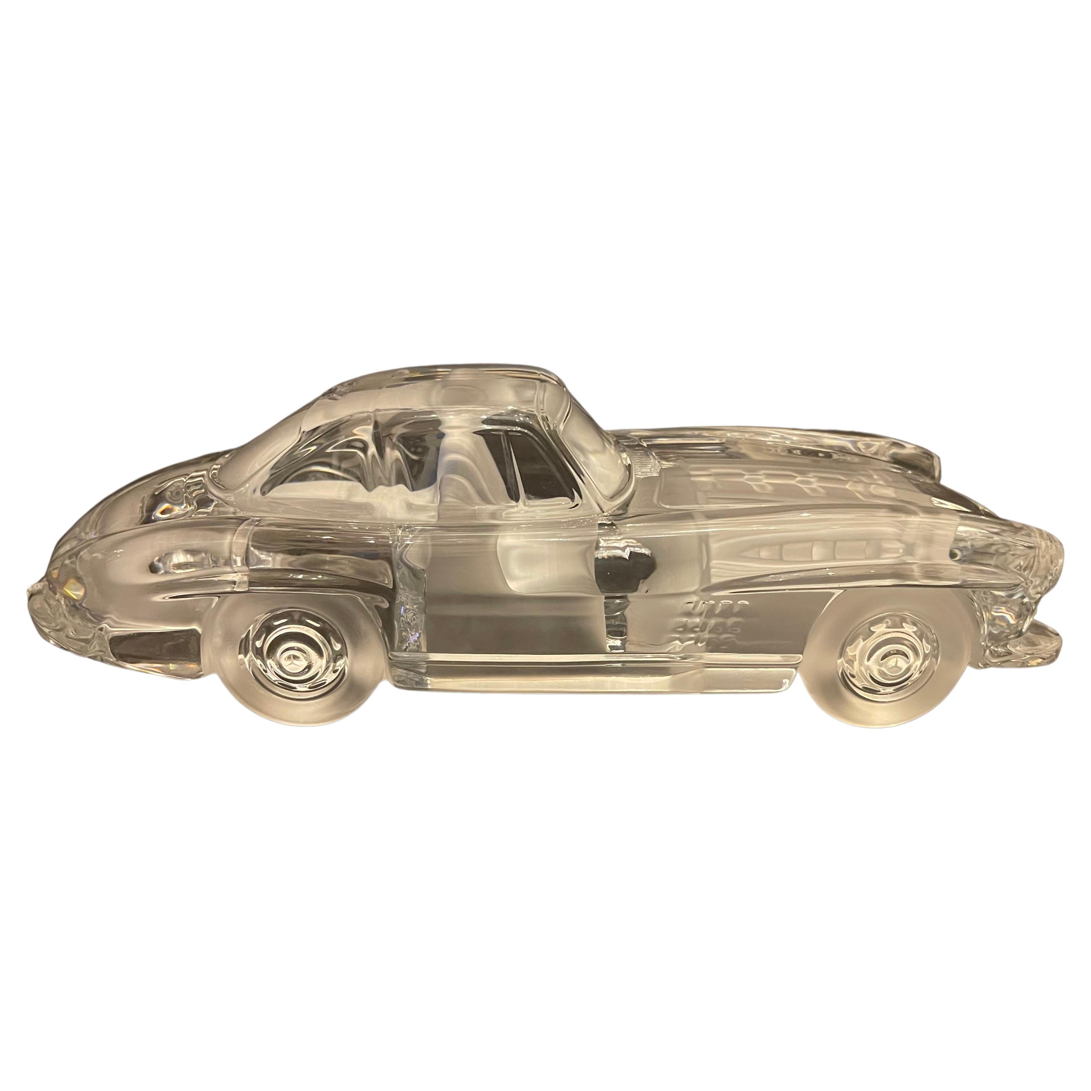 A wonderful art glass sculpture that is the perfect addition to any collection. Crafted by th world renowned glass maker Daum, this piece depicts a classic Mercedes Benz 300 SL Gullwing in stunning detail. The sculpture is made of high-quality glass