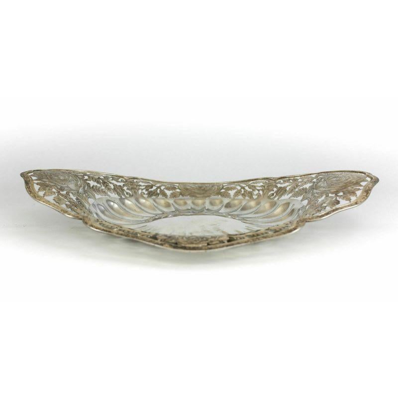 Fine davis & galt sterling silver centerpiece bowl art nouveau.

Centerpiece bowl in Rose Davis & Galt Sterling silver pierced in Art Nouveau style. # 1186 L. Retailed by Spaulding & Co. very finely hand-engraved decoration of roses, stems and