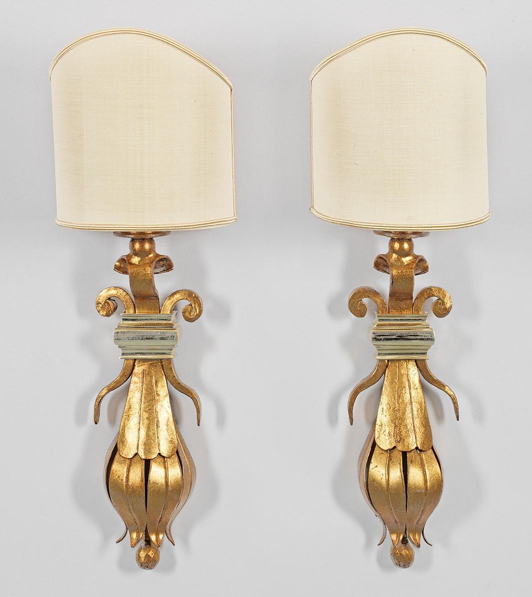 Anonymous
Last half of the 20th century; Germany
Gilt and lacquered metal

Approximate size, including shade: 22.75 (h) x 8 (w) x 4 (d) in.

A pair of distinctive and fine European wall sconces with a baluster-styled shape comprised of foliage and
