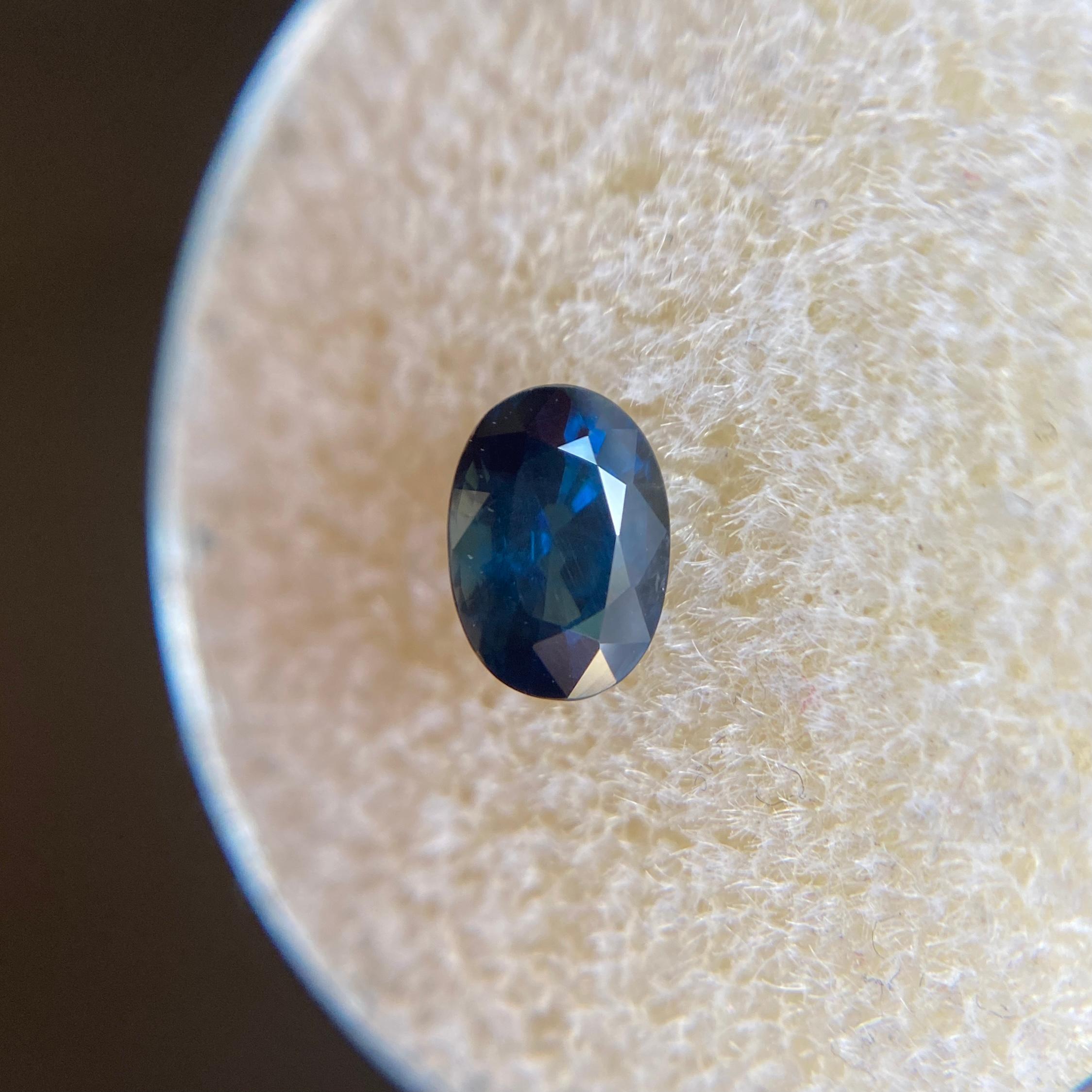 Fine Natural Australian Blue Sapphire Gemstone.

0.87 Carat with a beautiful deep fine blue colour and good clarity, a clean stone with only some small natural inclusions visible when looking closely.

Also has an excellent oval cut and ideal polish