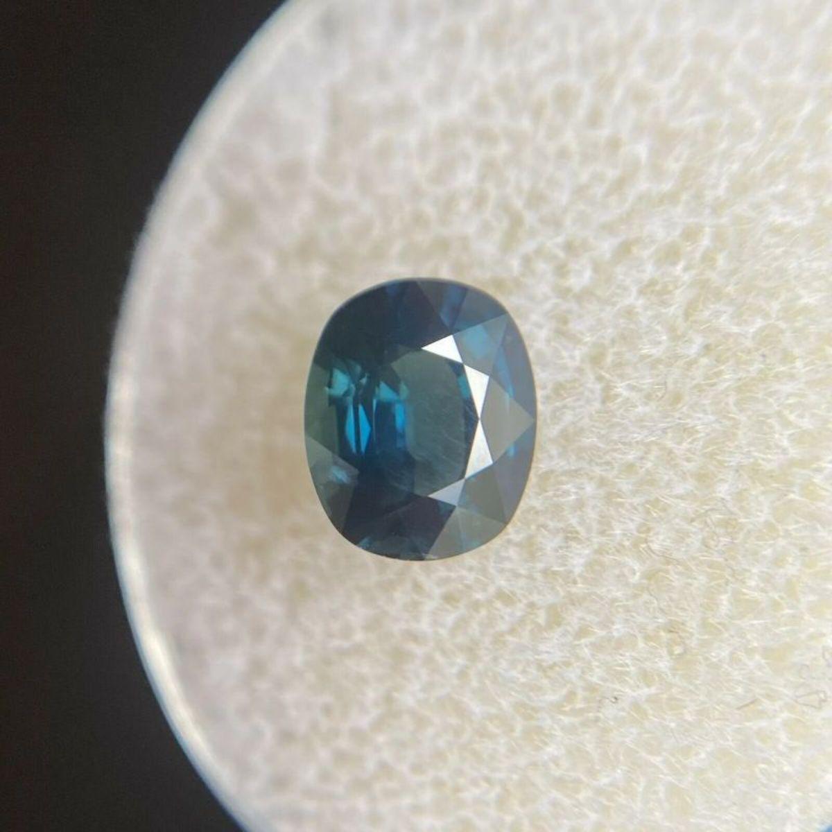 Fine Deep Teal Blue Sapphire 1.55ct Cushion Cut Rare Natural Gem 7.4 x 6.2mm

Fine Deep Teal Blue Sapphire Gemstone. 
Natural sapphire with a stunning deep teal blue colour. 1.55 Carat with excellent clarity. Practically flawless. 
Also has an