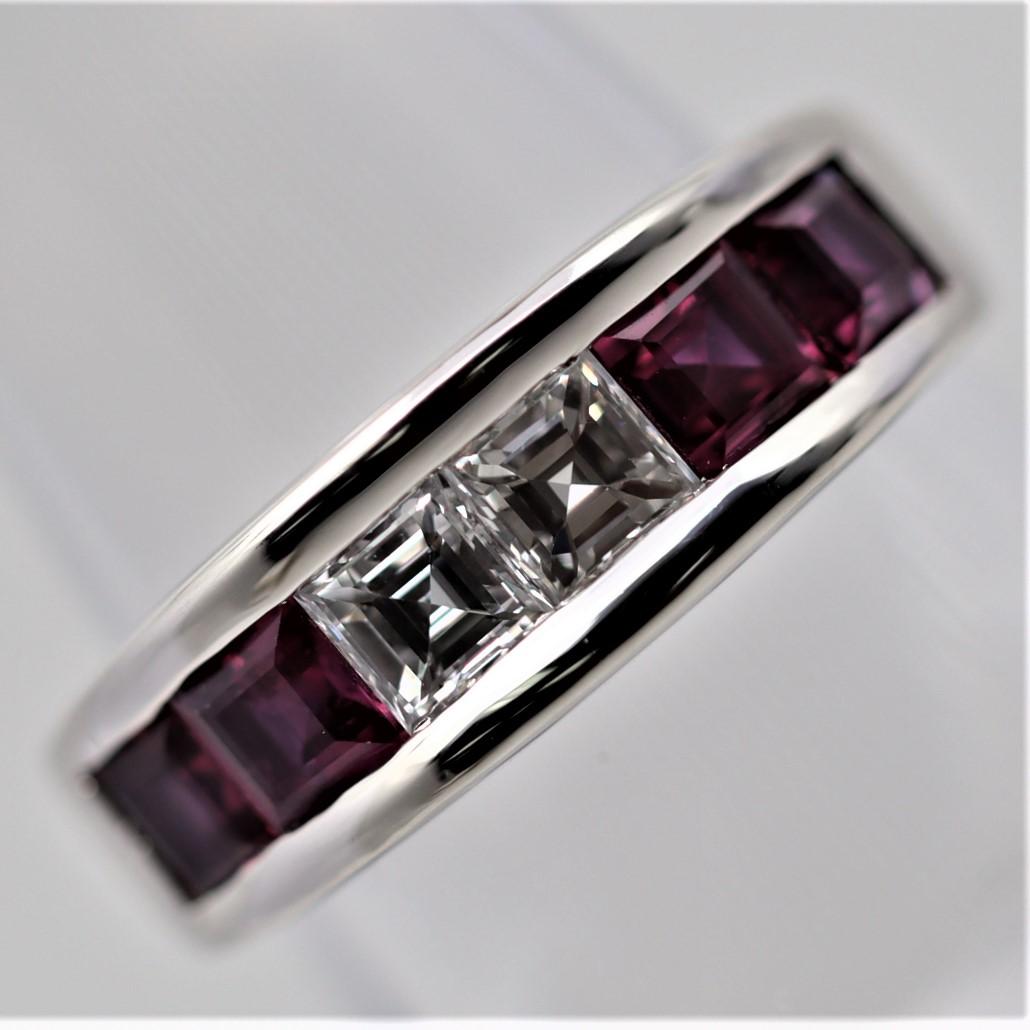 A simple yet elegant and fine quality platinum band featuring 2 large asscher-cut diamonds weighing 0.75 carats, about 0.37 carats each! Large and bright white stones. They are complemented by 4 square shaped rubies with a lovely red color weighing