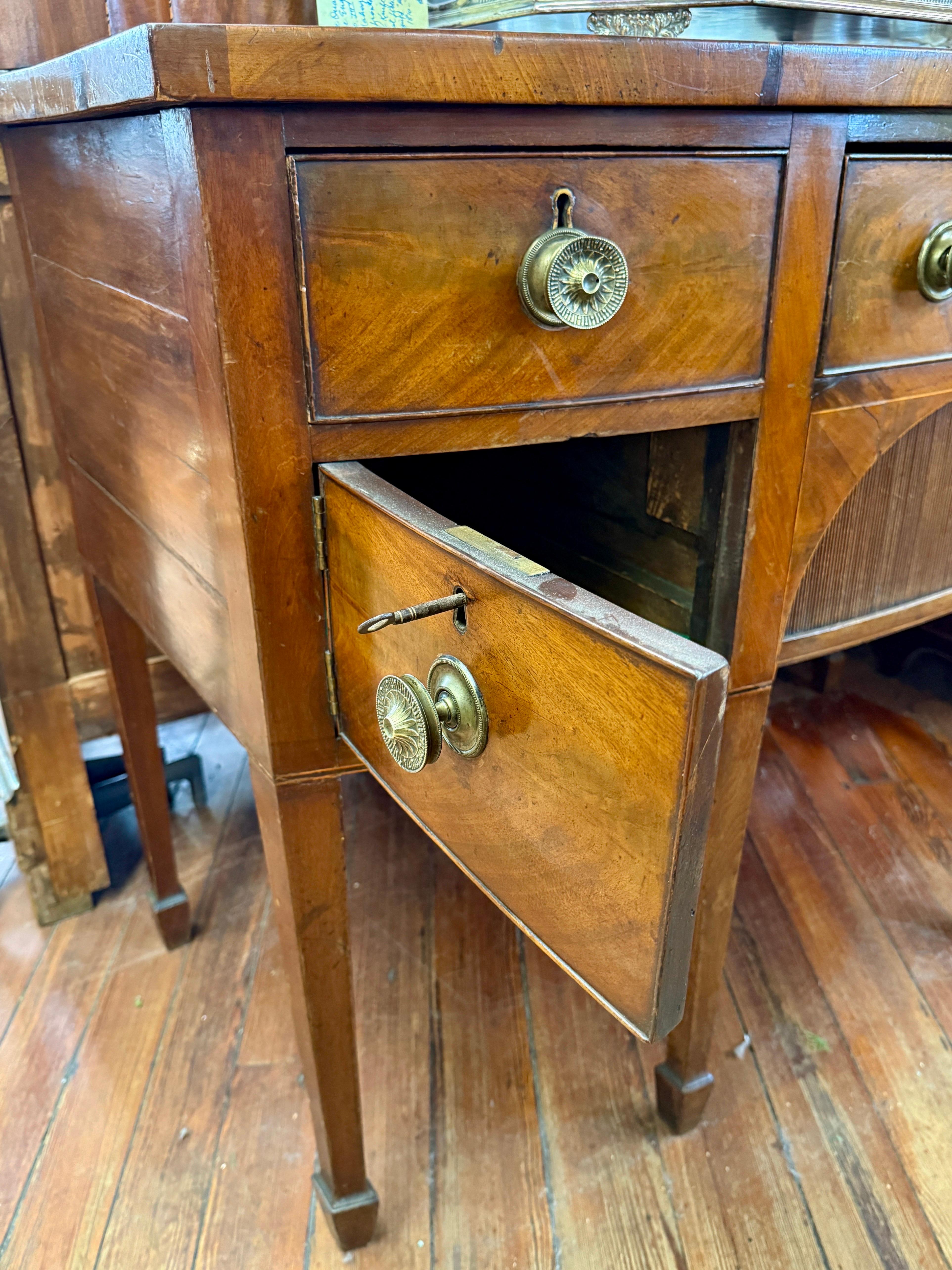 Brass Fine Early 19th C. Geo. III Figured Mahogany Bowfront Hepplewhite Sideboard For Sale