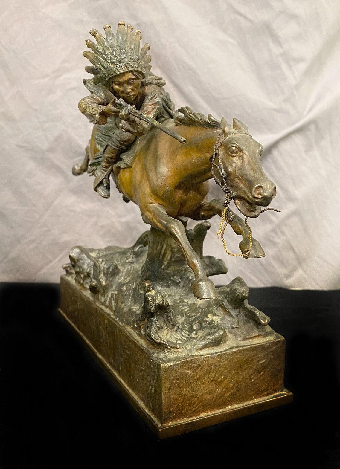 A very fine early 20th century Austrian bronze of an Indian Chief on Horseback by Carl Kauba.

Carl Kauba

The Native American in full war bonnet headdress and traditional clothing leaning over on his horse with his rifle ready to