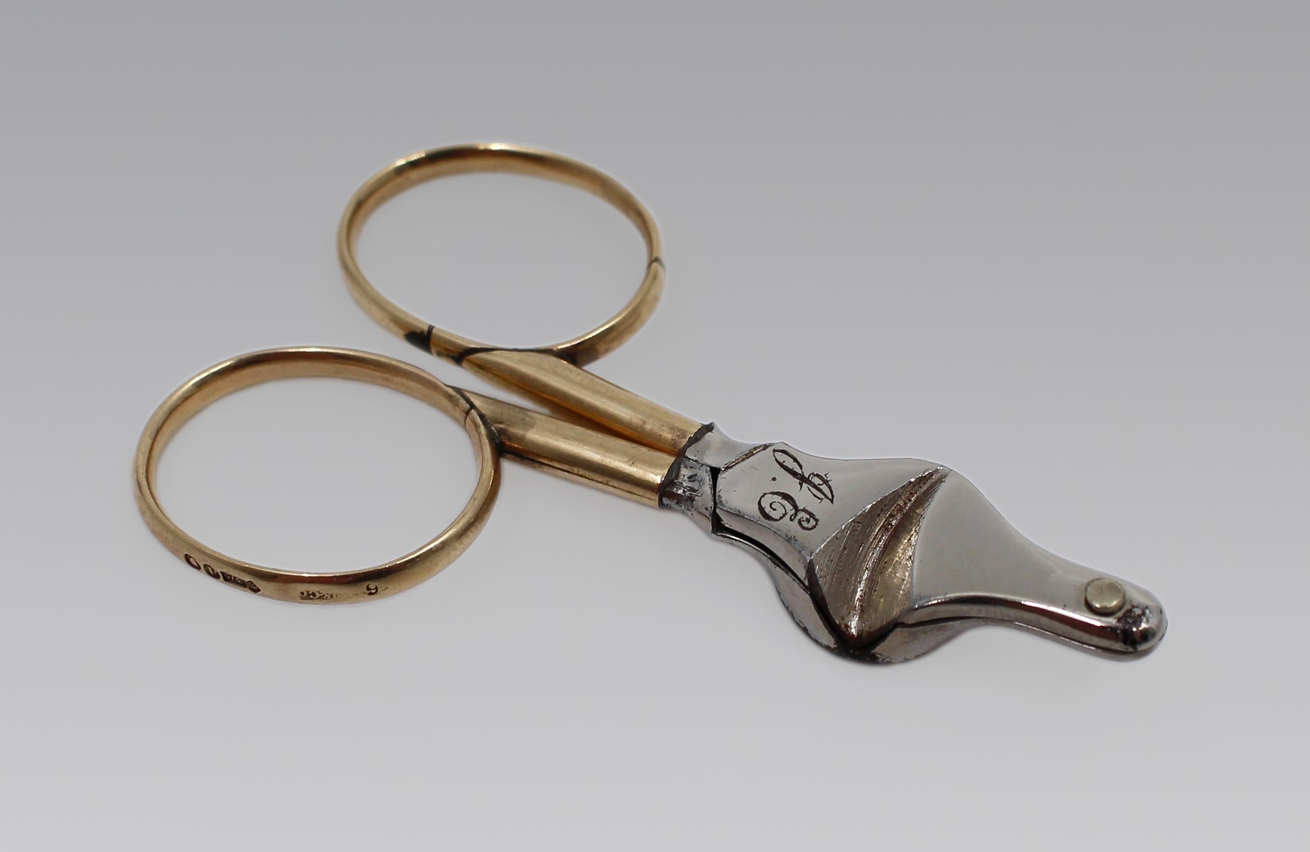 Fine Early 20th Century Cigar Scissors by Maple & Co., London 1919
English, dated 1919

A refined and well-crafted pair of cigar scissors by Maple & Co., featuring 9ct gold finger rings and a steel cutting mechanism. Fully hallmarked for London,
