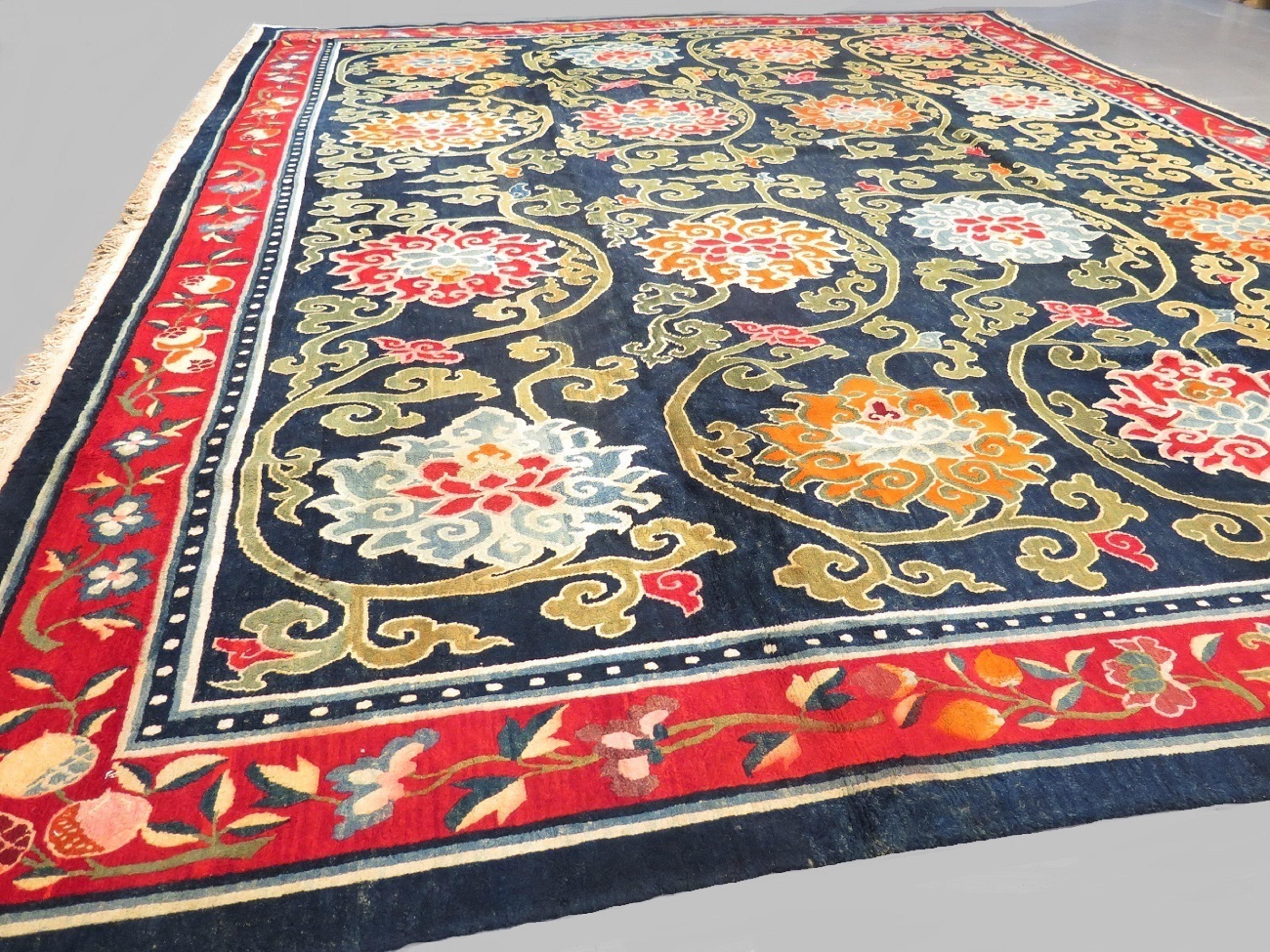 A unique and elegant Tibetan carpet in a rare room-size format - likely commissioned at the time for a member of the nobility, as most Tibetan pieces of the period were woven in a small rug format. The blue field provides a great contrast to the