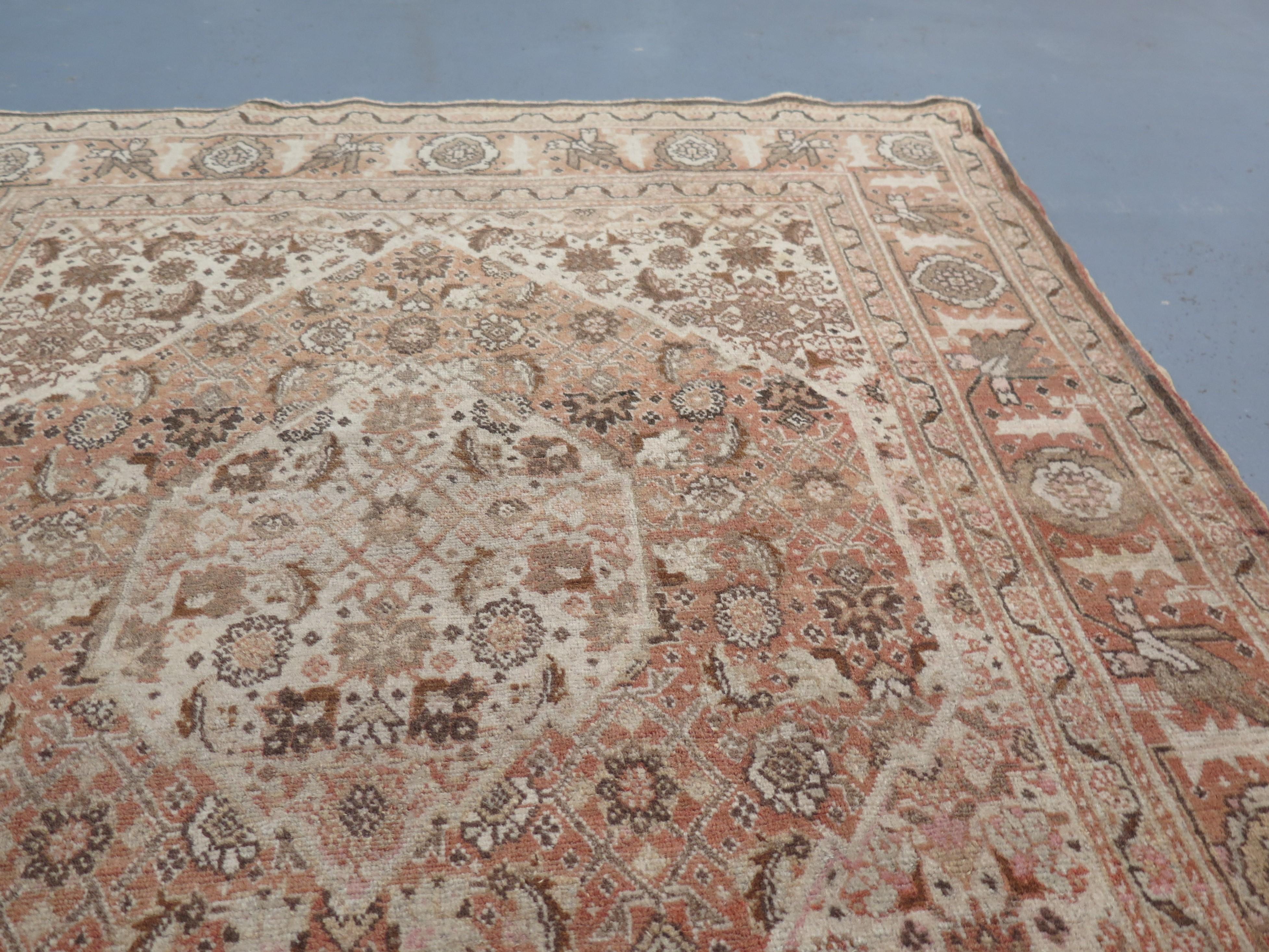 Antique Tabriz carpets are distinguished by their fine weaves and remarkable adherence to the traditions of Classical Persian rug design. This elegant c. 1890s example is associated with the Master weaver, Hadji Jalili, well known as the artist