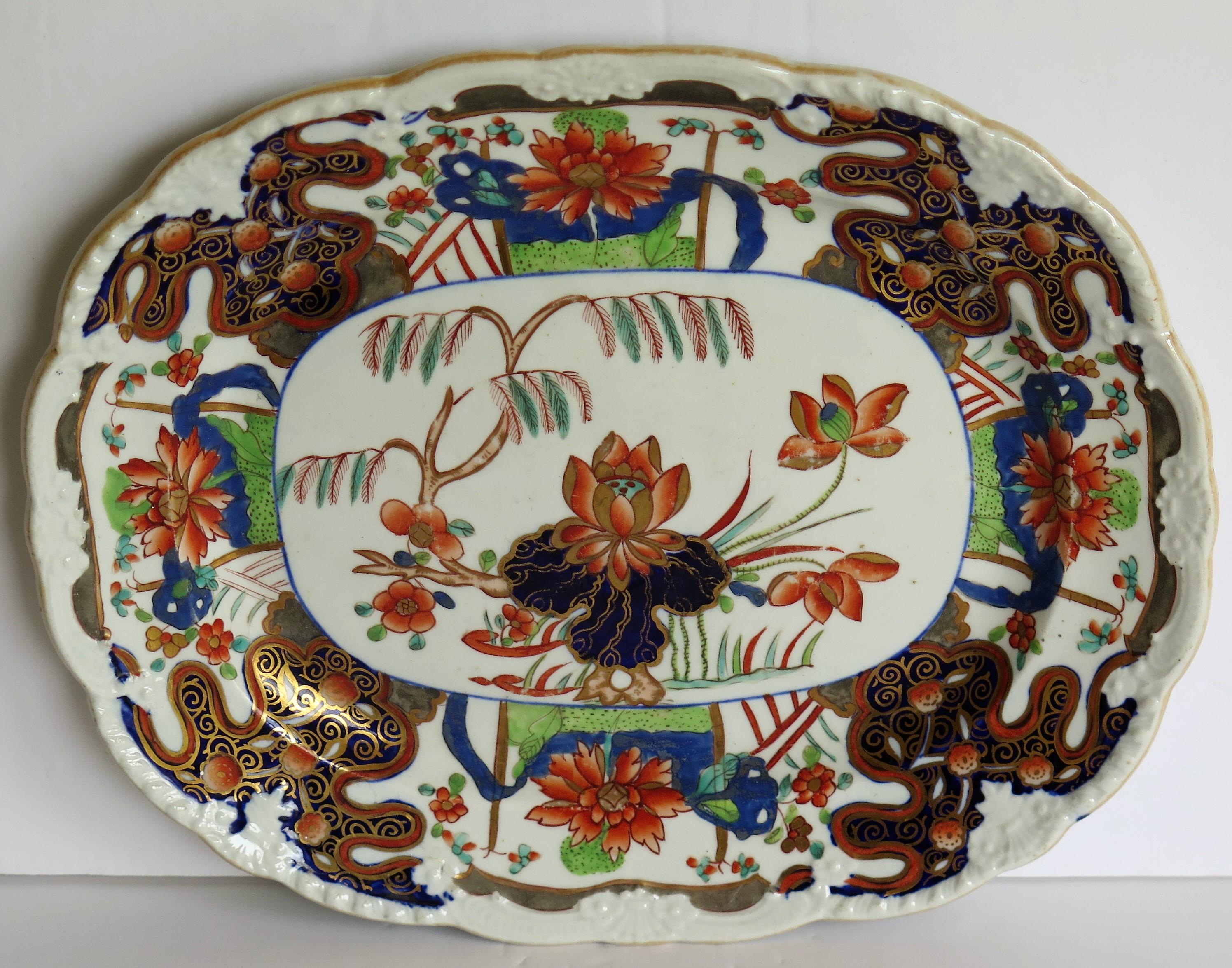 This is a beautifully hand painted oval platter or desert dish in the rare Water Lily and Willow pattern by Mason's Ironstone, Lane Delph, England, dating to circa 1815.

The piece is well potted as an oval platter with a moulded wavy rim.

The