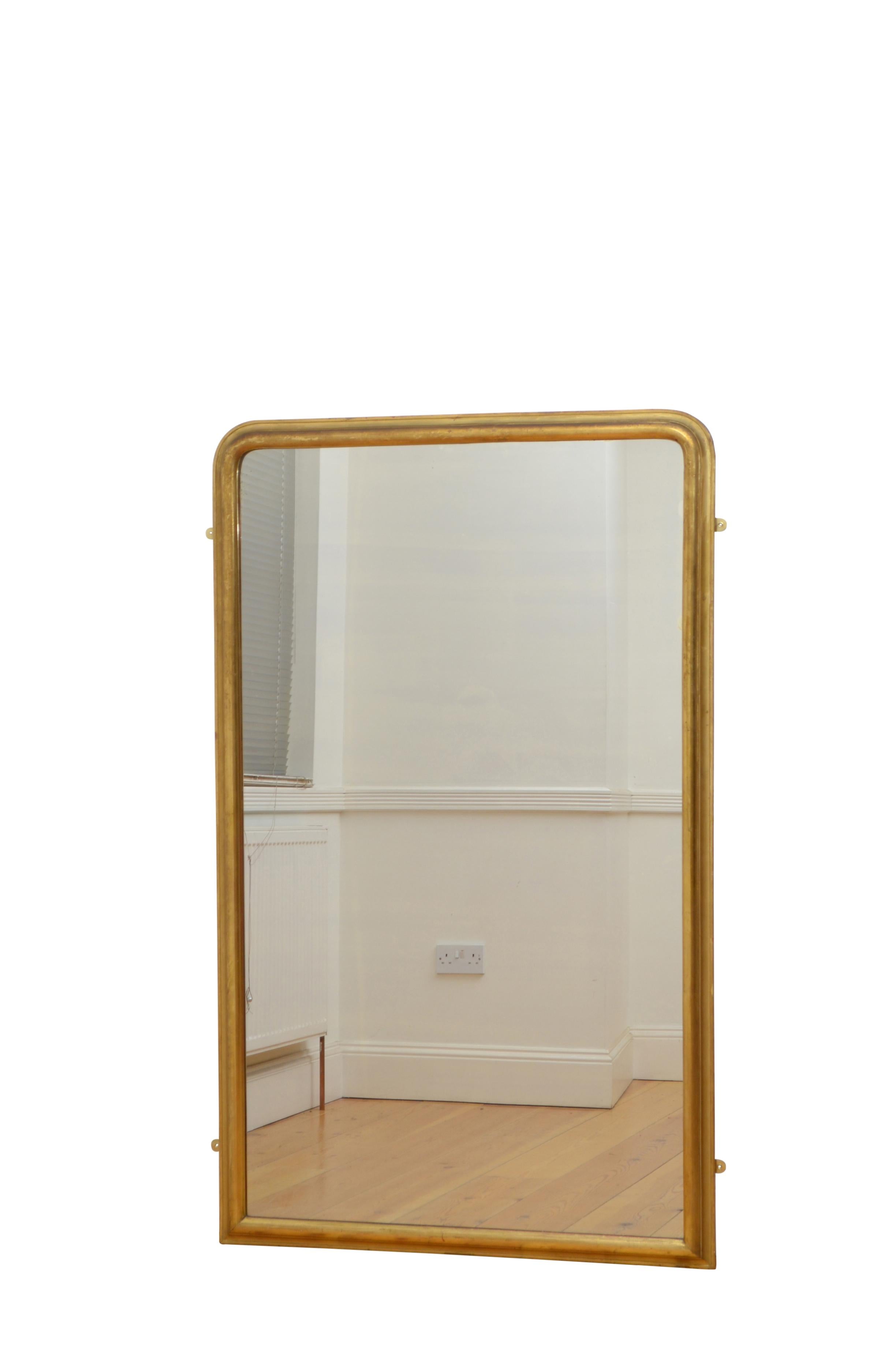 0235 fine quality, simple and elegant early 19th century full length or pier mirror, having original glass with air bubbles and some foxing in cushion moulded gilded frame.
This antique mirror retains its original glass, original gilt with red