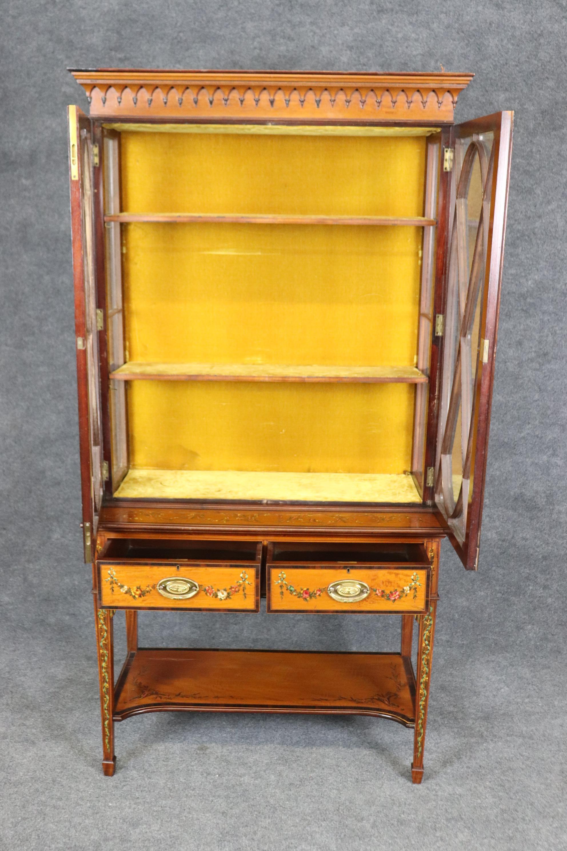 This is a fantastic English-made Edwardian vitrine made of walnut and satinwood. The cabinet is in good antique condition with minor signs of age and wear but nothing significant. The cabinet is a gem. Measures 78 tall x 40.5 wide x 19 deep. The