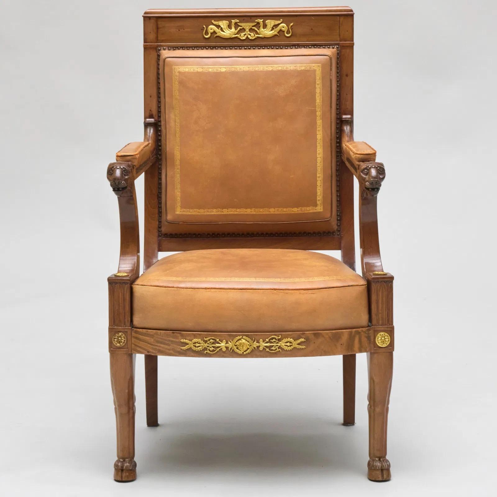 Fine Empire ormolu-mounted mahogany desk armchair upholstered in gilt-tool leather. Signed: 