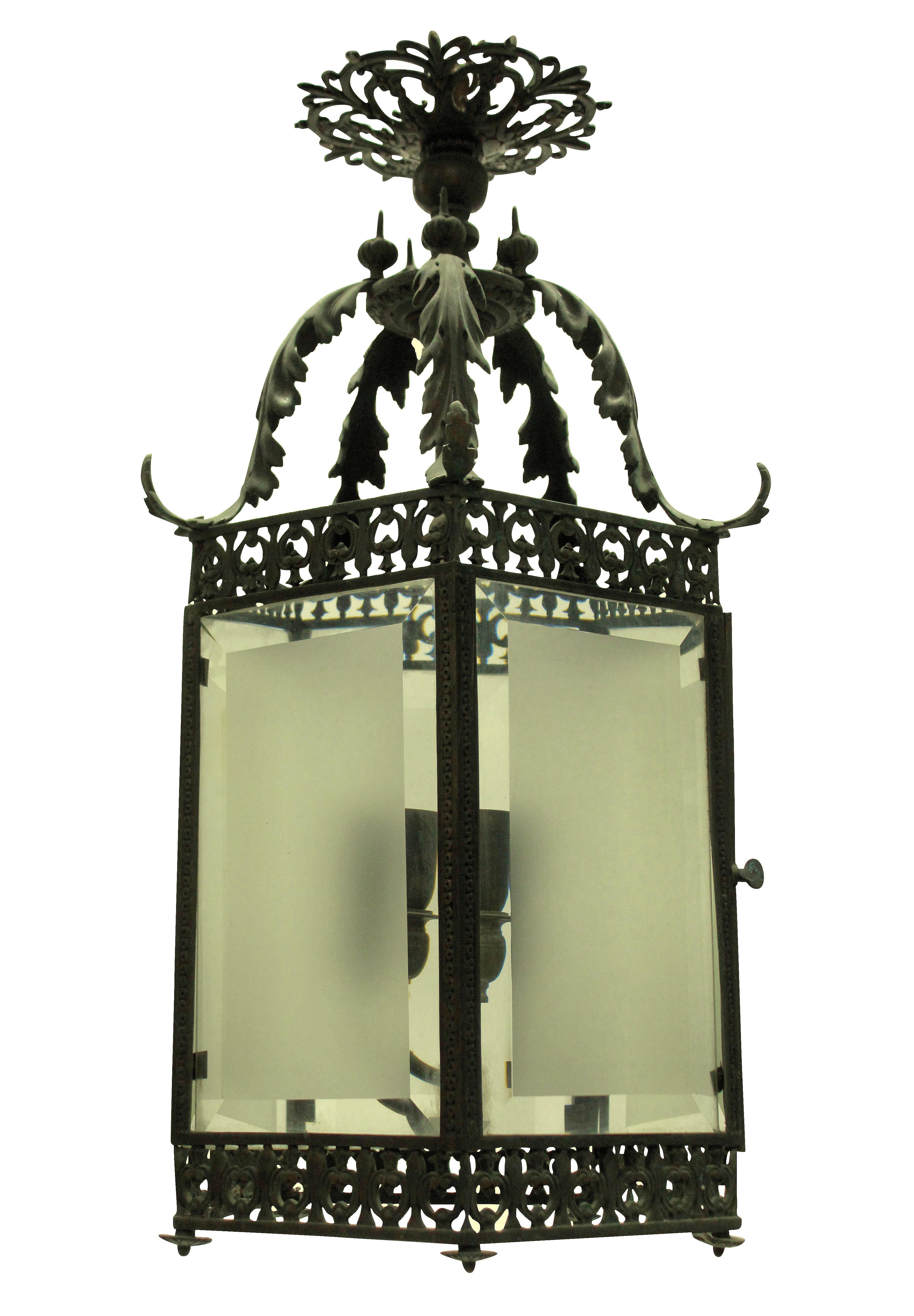 A fine English hexagonal hanging lantern in solid bronze with beveled and etched glass panels. In the 'Eastern' style.