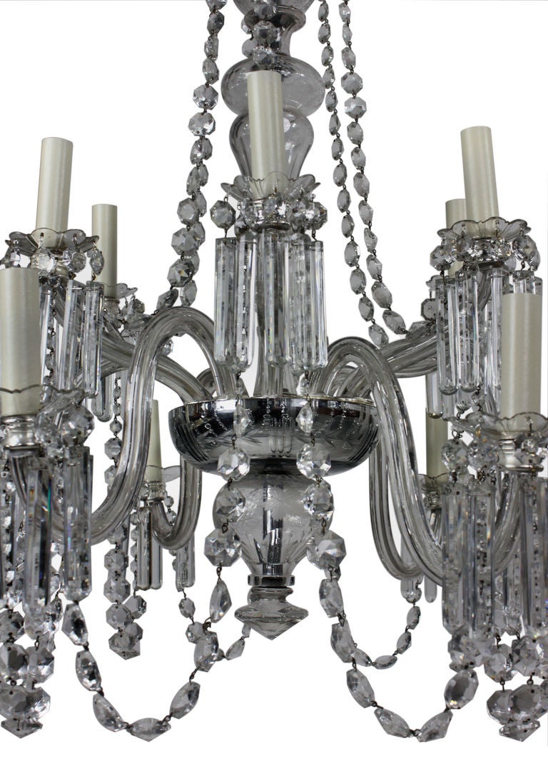 An English Edwardian twelve-branch cut-glass chandelier. Formerly a gasolier, of fine quality.

   